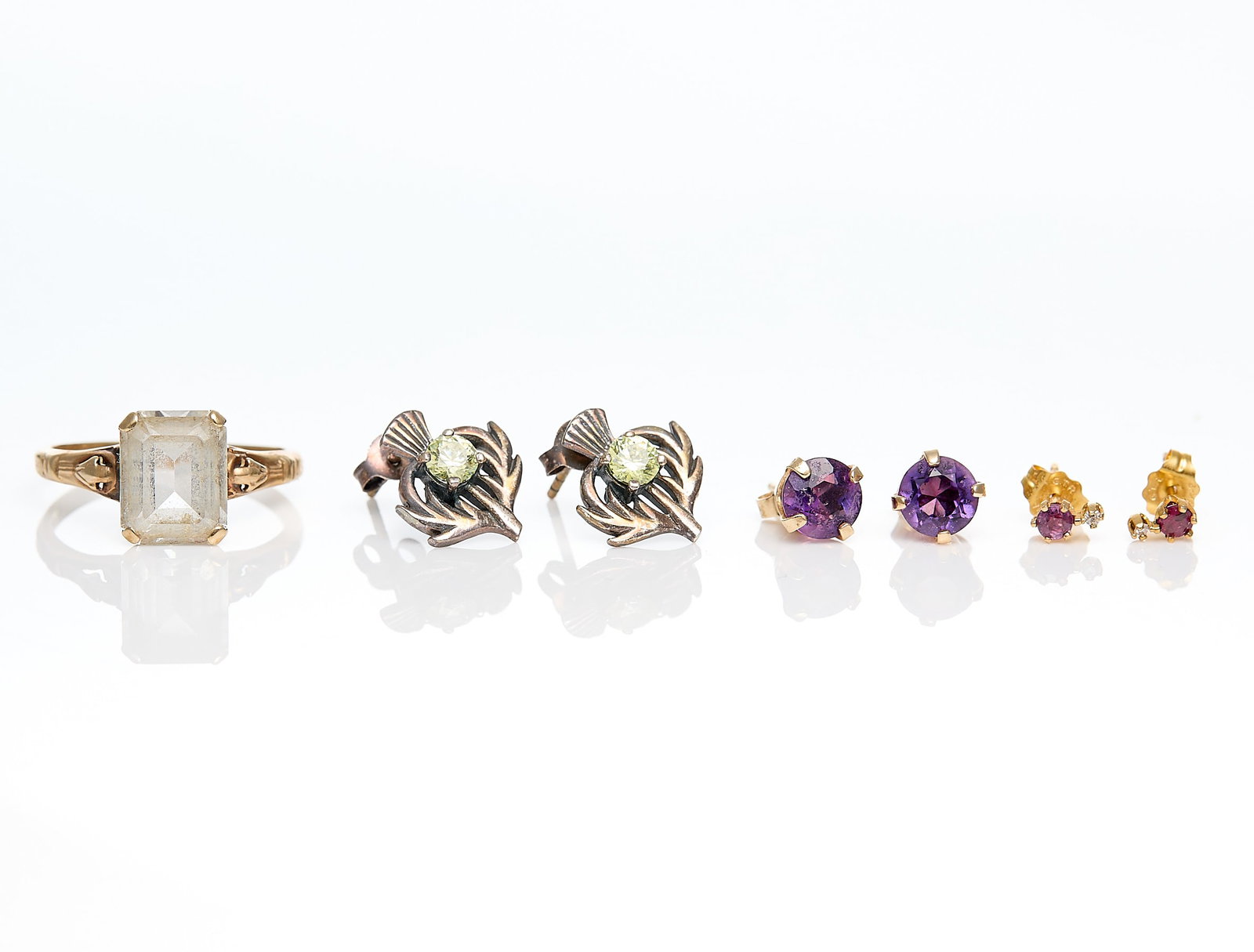 3 Prs Gold Earrings & 14k Ring: Group of three pairs of stud earrings and one ring including:Pair 14k yellow gold stud earrings, each set with round cut amethyst, on posts with butterfly backs. Marked 14k.Pair sterling silver thistl