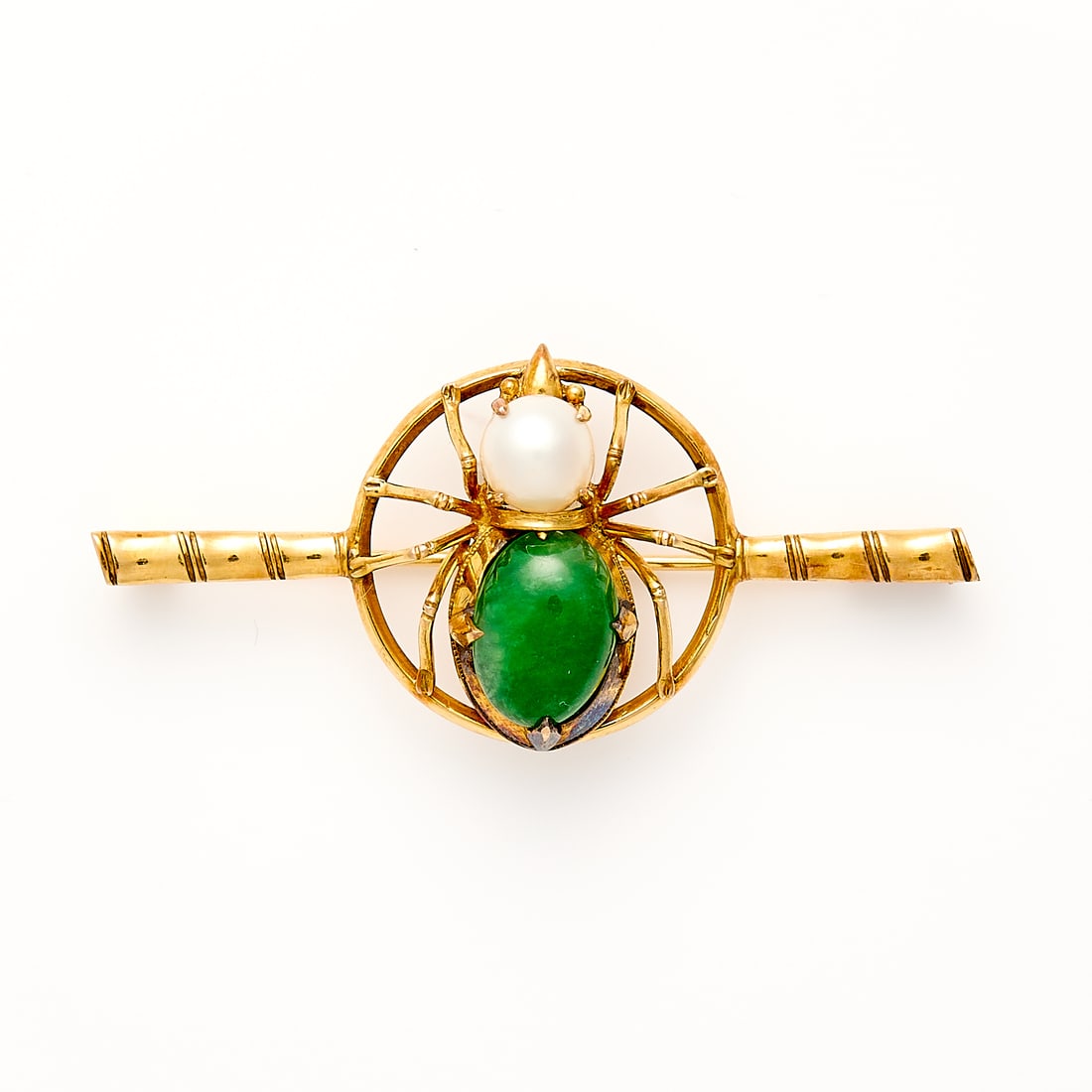 18k Chinese Spider Brooch: 18k yellow gold brooch with central element of a spider in a circle set with green cabochon hardstone & pearl. On a bamboo style pin. With a trombone clasp. Marked 18k and with Chinese marks. In origi