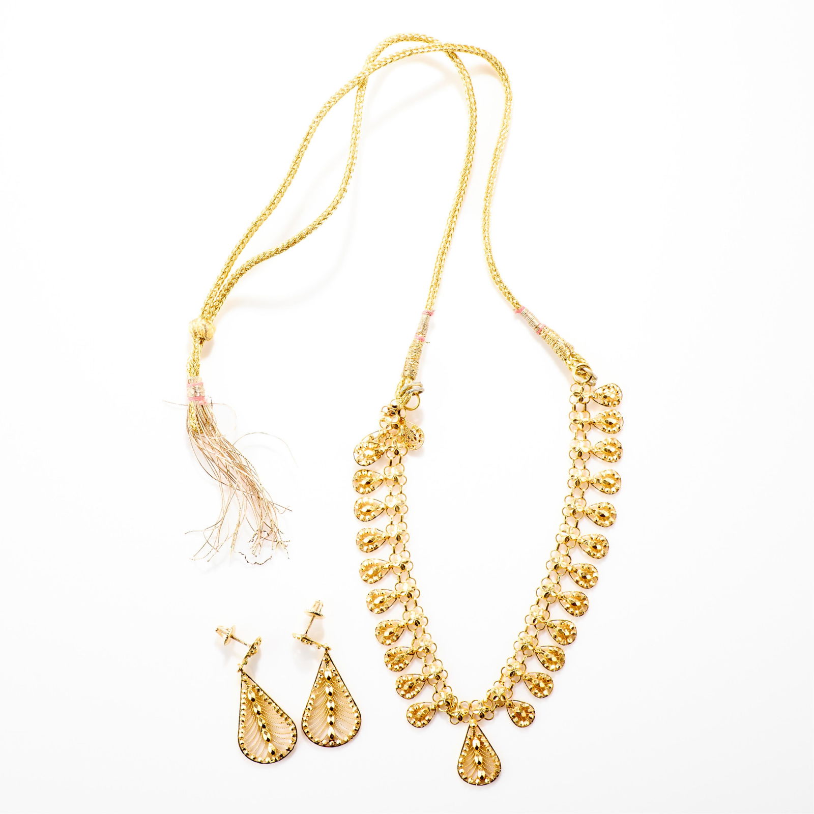High Karat Gold Necklace & Earrings: High karat gold necklace and earrings set. Including a pair of earrings, each set with with a small pear shaped filigree stud suspending a large pear shaped filigree stud. On posts with threaded and