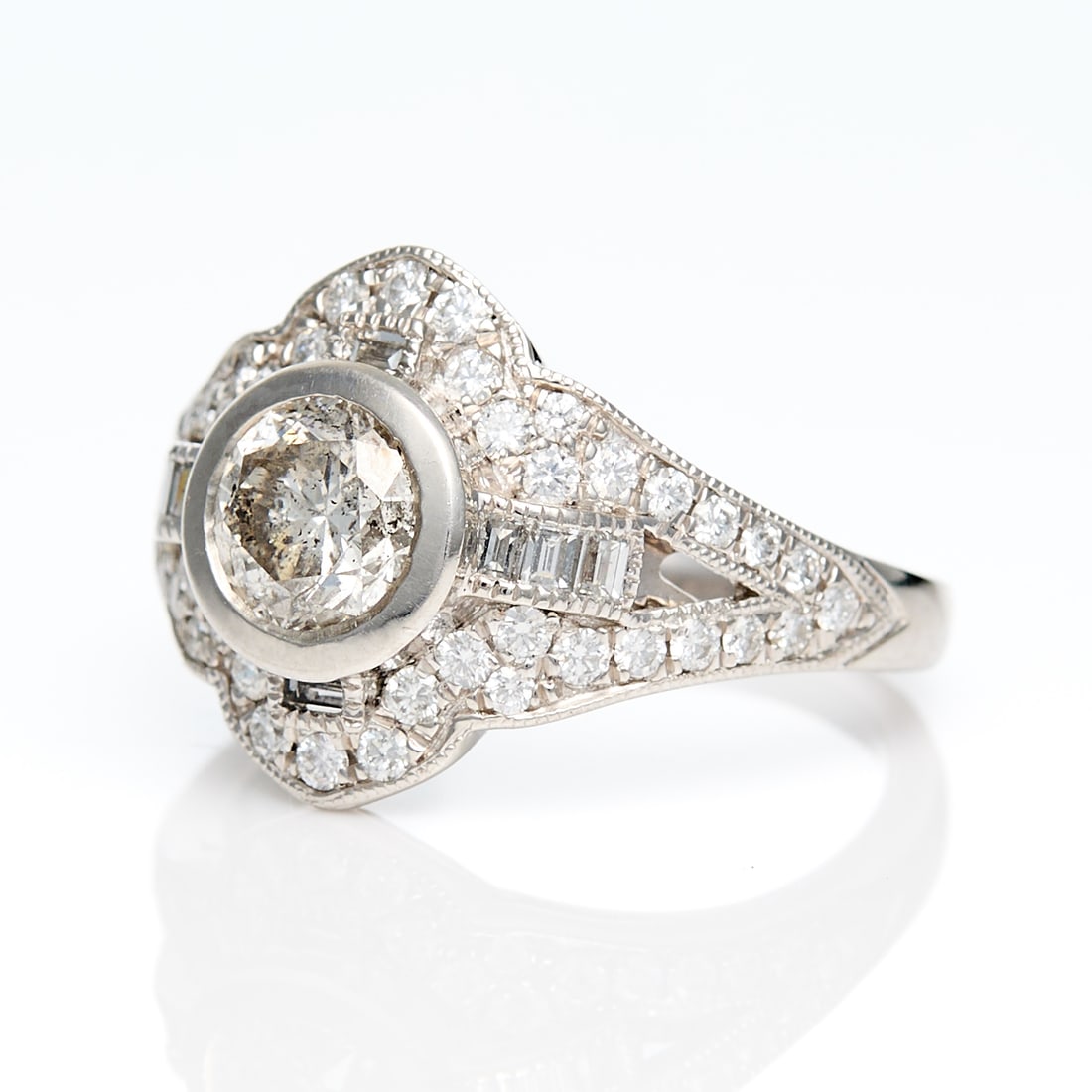 Sheffield & Sons Platinum & Diamond Ring Sz 6.75: Sheffield & Sons platinum ring set with central bezel set round brilliant cut diamond of 1.01 ct, H color and I2 clairty. With cruciform baguette diamonds and a quatrefoil surround with split shank sh