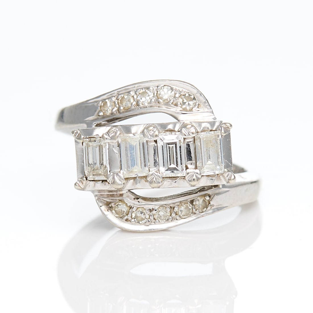 14k White Gold Diamond Ring Sz 5.75: 14k white gold ring set with four baguette diamonds of approximately .44 ctw and H-J color and bypass stylized loops of white gold, each set with five single cut diamonds. Marked 14k along the