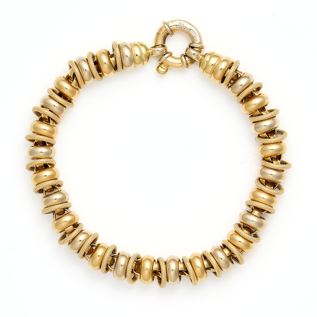Italian 18k Yellow Gold Bracelet: Italian 18k yellow gold belcher chain bracelt with textured and smooth links. On a spring clasp closure. Marked 18k Italy. Length: 8 in. Gross weight: 23.3 g.