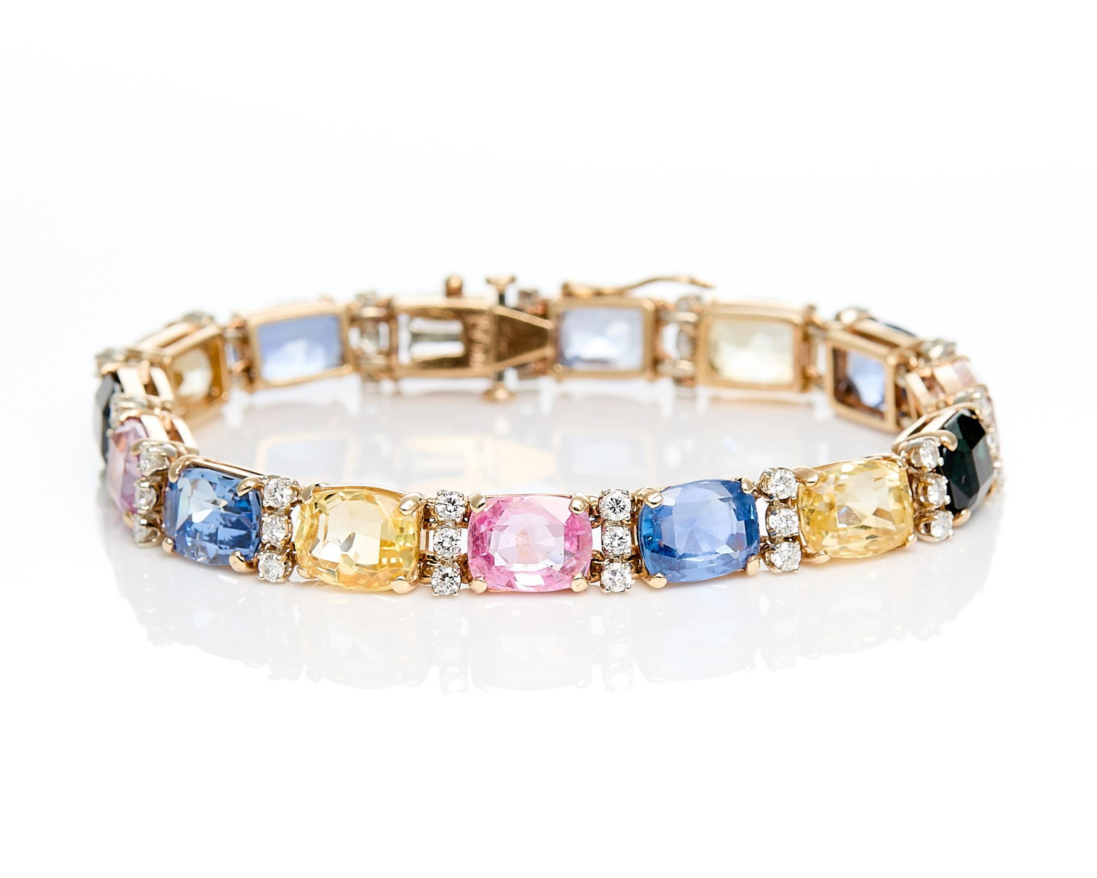 14k & GIA Natural Sapphire Bracelet - 39.39 ctw: S&S 14k yellow gold bracelet set with 15 cushion cut GIA certified natural Thailand or Sri Lankan (Ceylon) sapphires, showing no indications of heating. Colors range from blue, yellow, pink, and bluis
