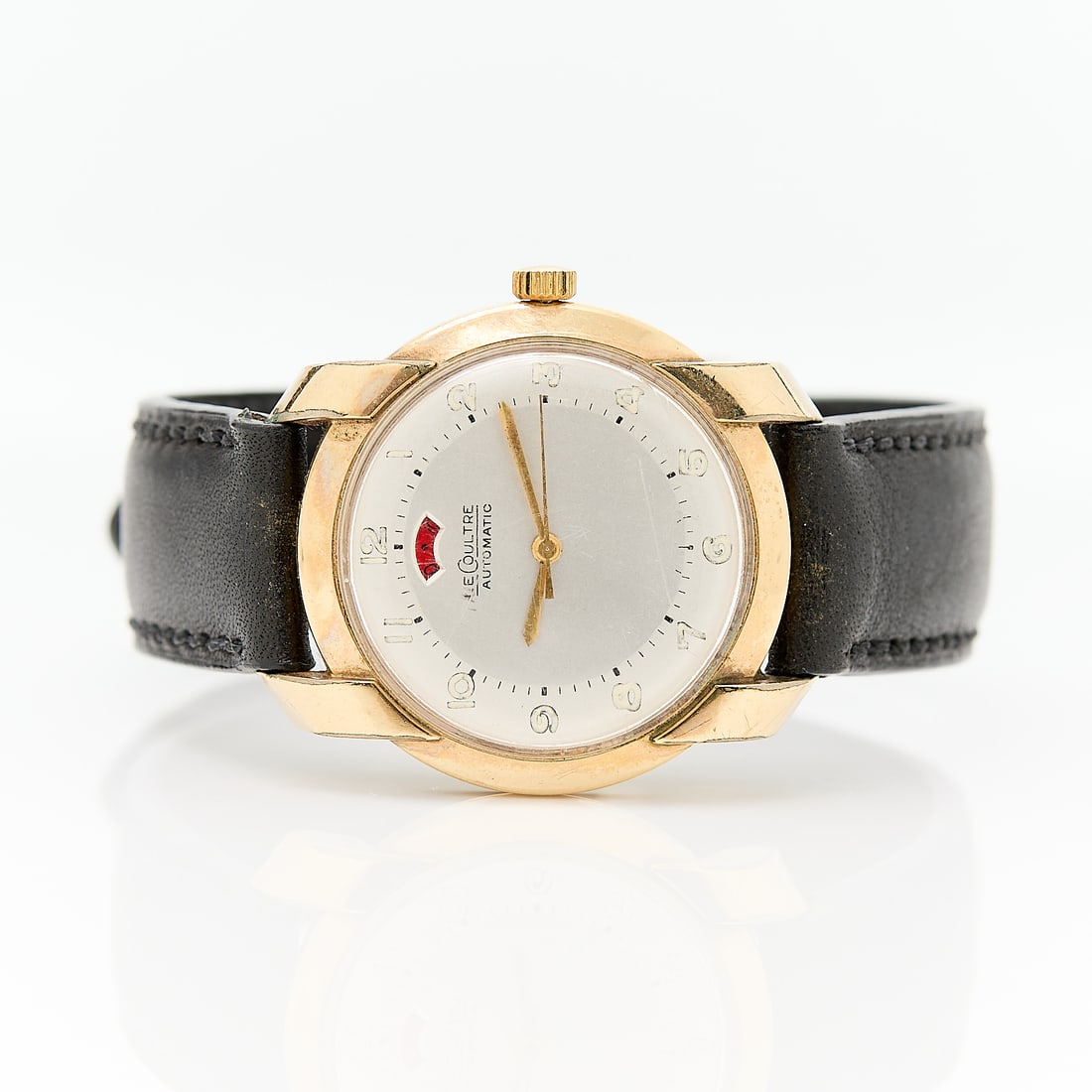 Jaeger LeCoultre Powermatic ca. 1950: Jaeger LeCoultre Powermatic watch, circa 1950. In 10k gold filled case with prominent lugs. White dial marked LeCoultre Automatic with Arabic numeral hour indices with lume, gold hands, and window