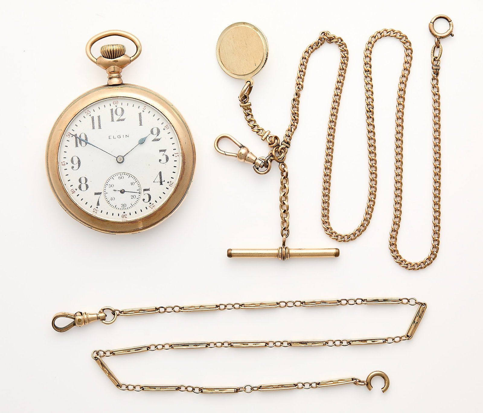 Elgin Gold Filled Watch & 2 Watch Chains: One Elgin gold filled open face pocket watch with white dial, Arabic numerals, and subseconds dial. Serial number 18932680. Back case interior marked warranted B&B Royal 20 Years 6961619. Two gold
