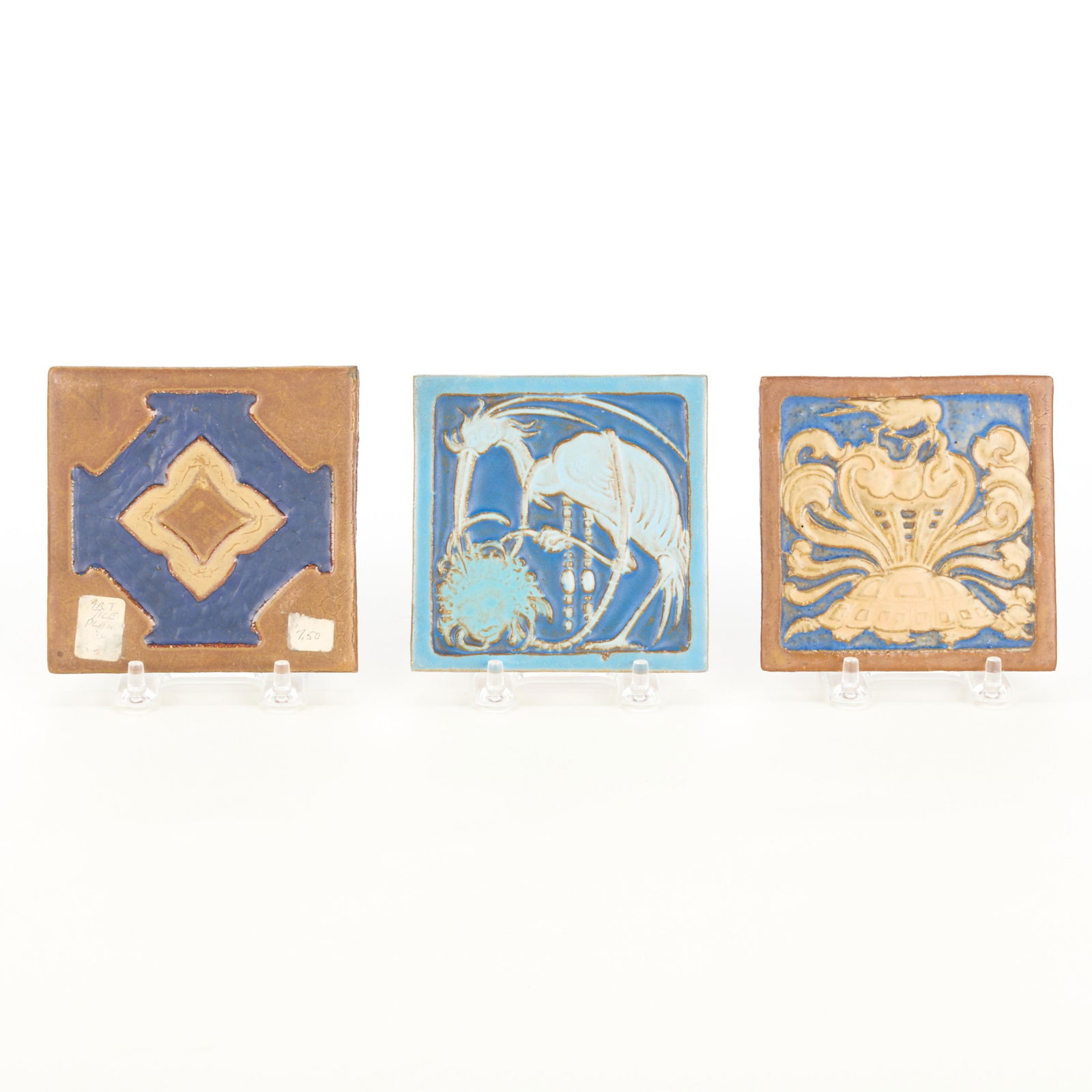 3 Mosaic Tile Co. Arts & Crafts Pictorial Tiles: Mosaic Tile Company, Zanesville, Ohio. Group of three American Arts & Crafts ceramic pictorial pottery tiles, early 20th century. Including one depicting an architectural or geometric motif and two ti
