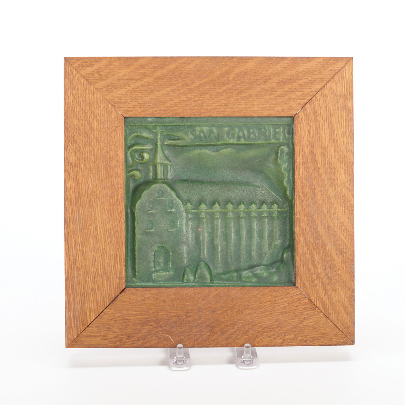 California China Co. "San Gabriel" Pottery Tile: California China Products Company (CCP Co.), United States. Arts & Crafts pottery molded pictorial relief tile depicting San Gabriel Mission, ca. 1911-1917. With matte green glaze. Marked "Kaospar" al