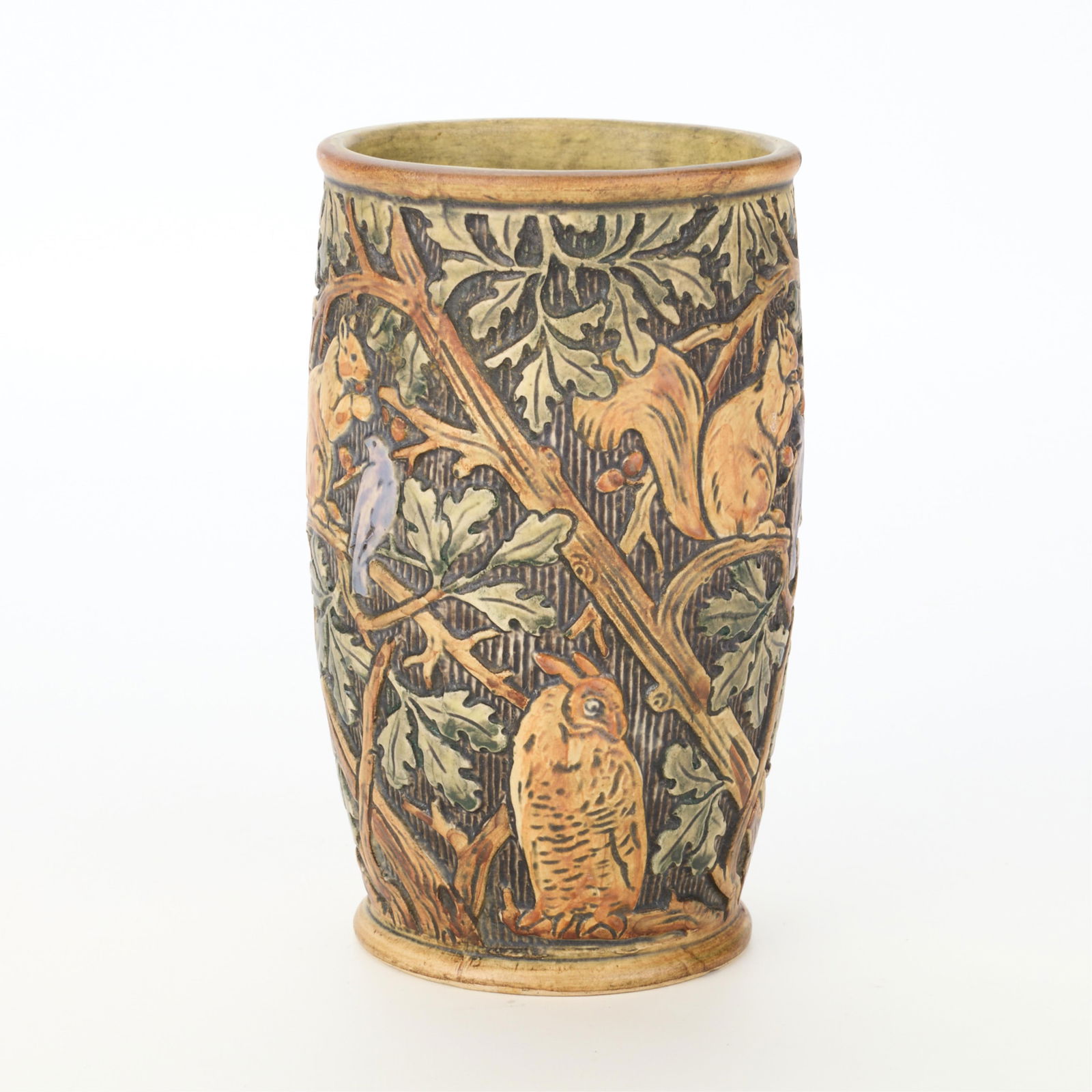 Weller Art Pottery Matte "Knifewood" Vase ca. 1910: Weller Pottery, Zanesville, Ohio. Art Pottery "Knifewood" pattern vase, ca. 1920s. Depicting a lively assemblage of squirrels, birds, and owls perched on branches amid oak leaves. Earthenware with mat
