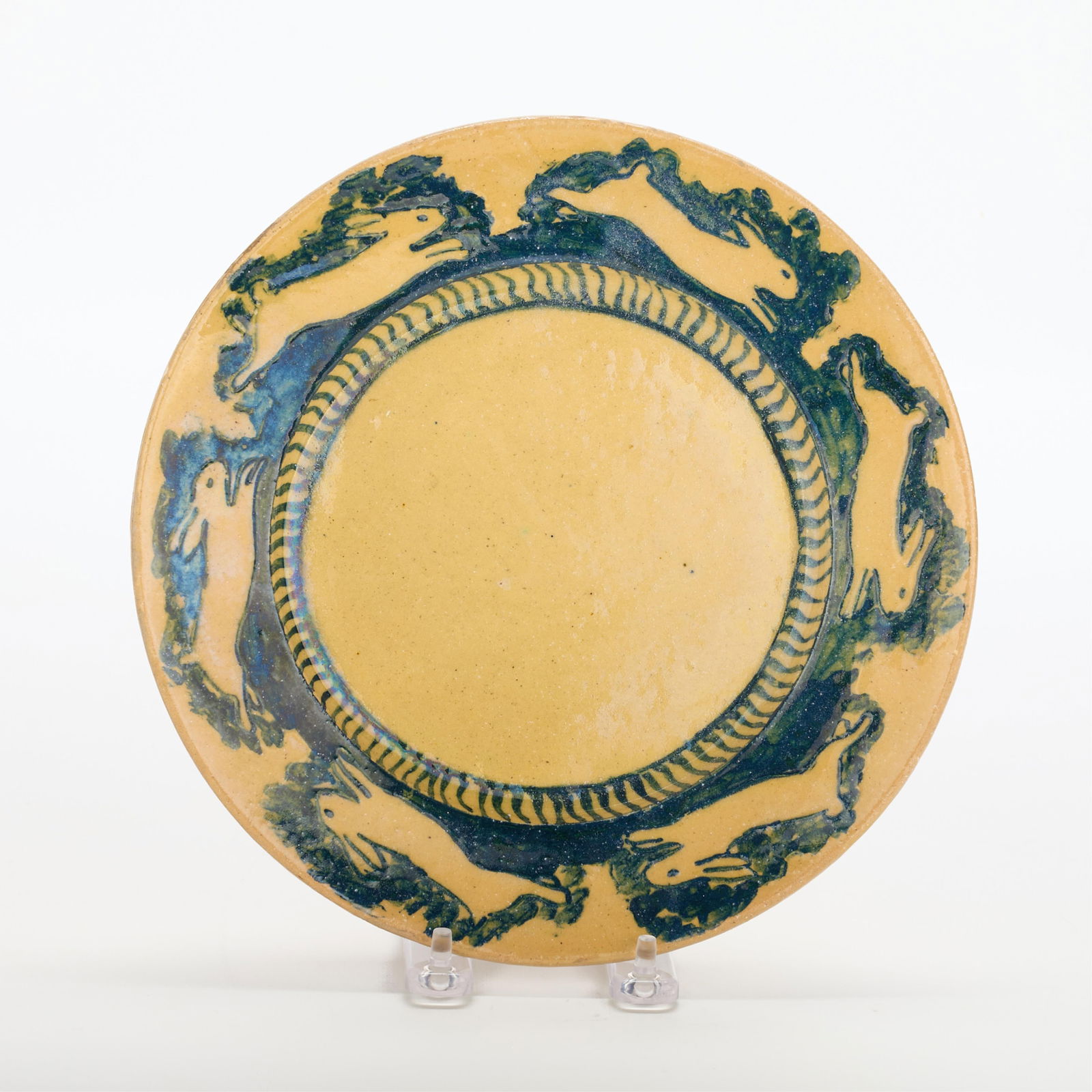 Attr. Pewabic Art Pottery Ceramic Rabbit Plate: Attributed to Pewabic Pottery, Detroit, United States. Art pottery ceramic plate depicting prancing rabbits along the rim, ca. 1905-1910.Diameter: 9 1/4 in.