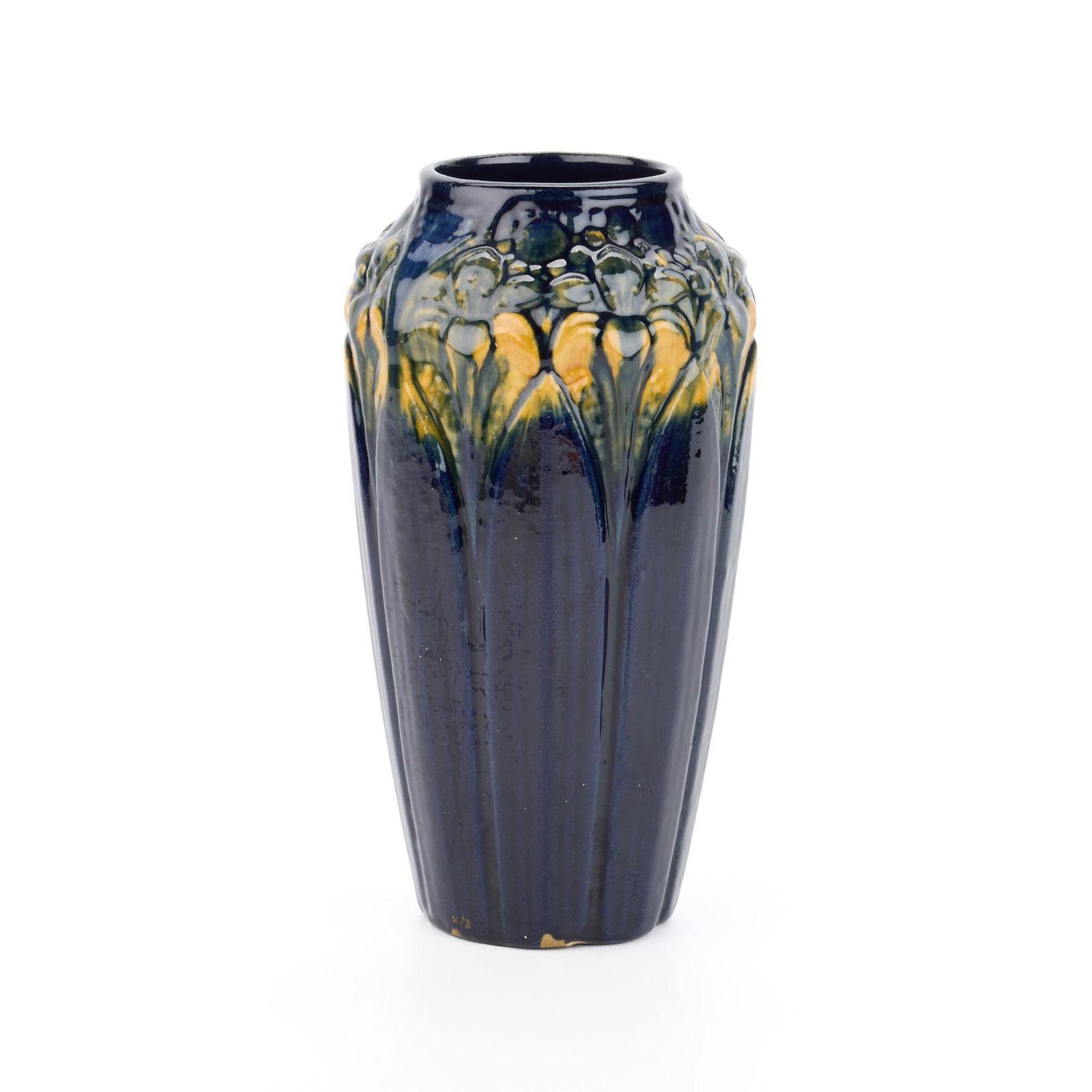 Brush McCoy Art Pottery "Amaryllis" Majolica Vase: Brush McCoy, United States. Art pottery "Amaryllis" maiolica ware cabinet vase, ca. 1920s. Depicting floral motifs in relief, executed in rich blue and yellow glazes.Height: 10 1/2 in x diameter: 5 1/
