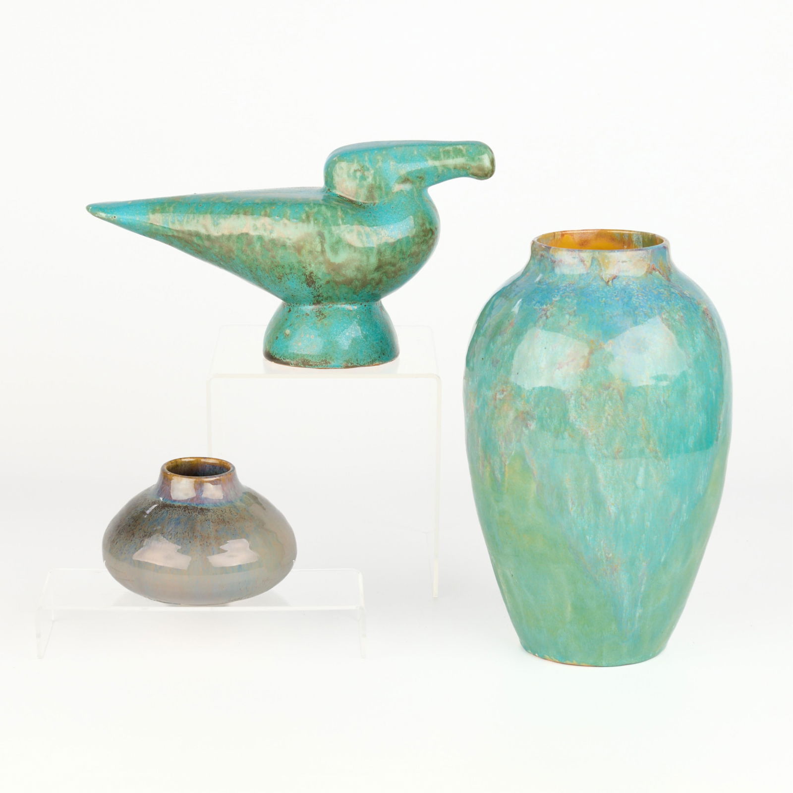 3 Shearwater Art Pottery Objects: Shearwater Pottery, Mississippi, United States. Group of three vintage art pottery objects. Including:One eagle form paperweight or decorative figure with mottled green, brown, and turquoise glaze. Wi
