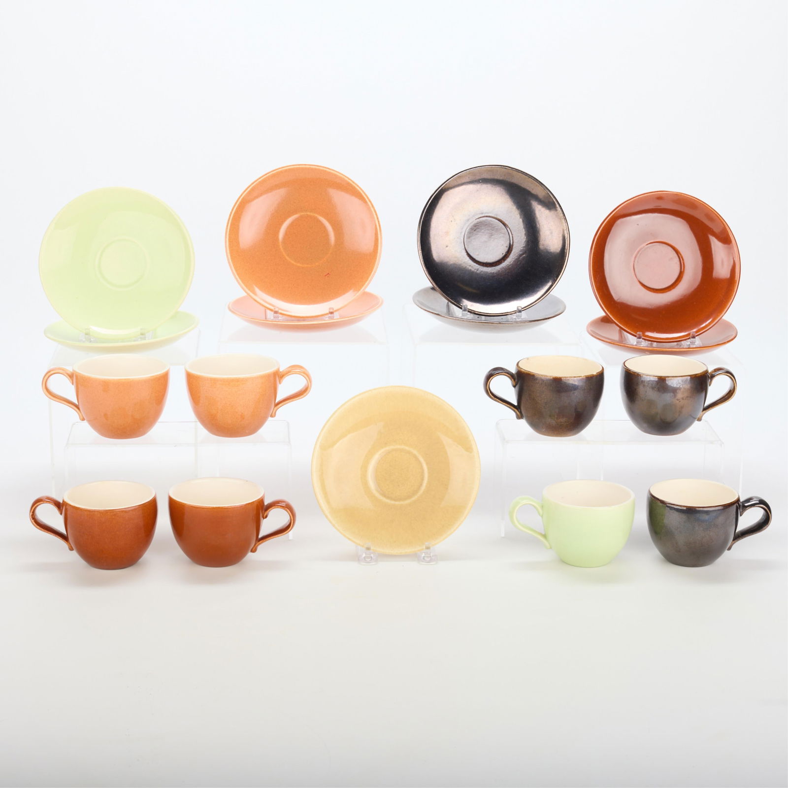 18 Zeisel Red Wing "Town & Country" Cups & Saucers: Eva Zeisel (Hungarian-American, 1906-2011) for Red Wing Pottery, Minnesota. Set of 18 "Town & Country" glazed earthenware teacups and saucers, mid-20th century. Including: nine tea cups and nine sauce