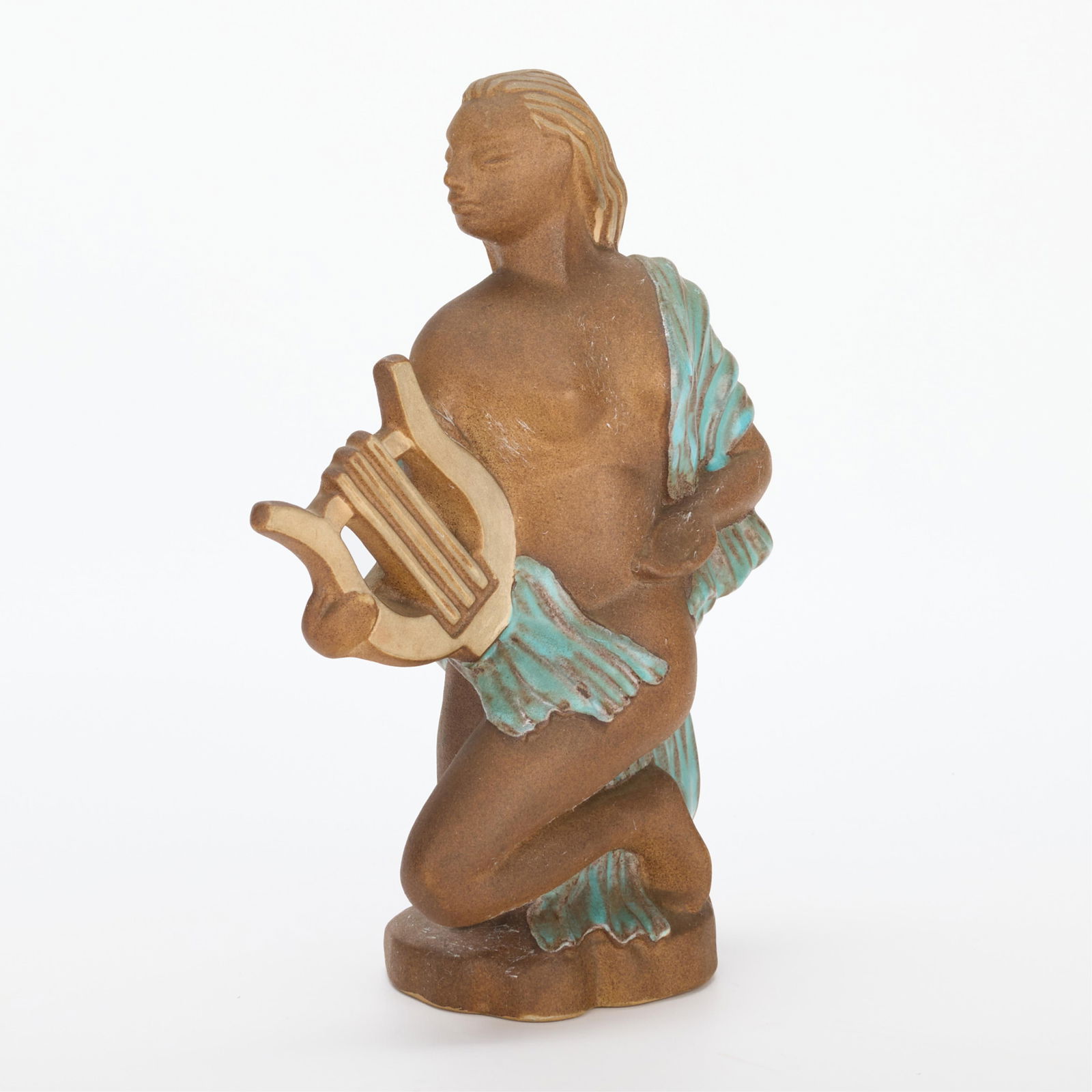 Charles Murphy Red Wing Stoneware Figure: Charles Murphy (American, 1909-1994) for Red Wing Pottery, United States. Art Deco stoneware figure of a kneeling woman draped in blue fabric and holding a harp. Impressed along the underside "Red