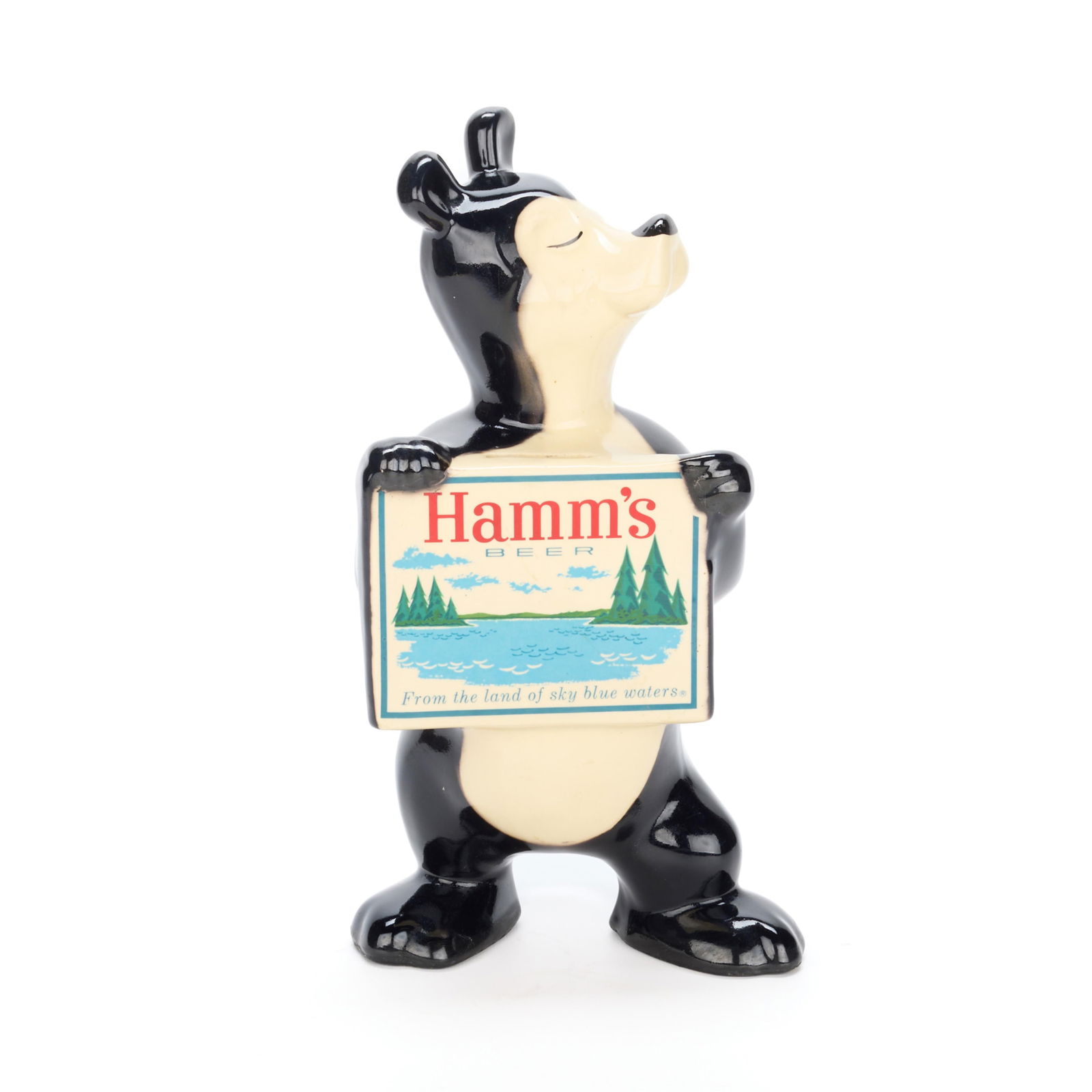 Red Wing Pottery Hamm's Beer Bear Advertising Bank: Red Wing Pottery, Minnesota. Vintage ceramic promotional advertising memorabilia coin bank produced for Theodore Hamm Brewing Company, depicting the iconic Hamm's bear mascot holding a sign reading,