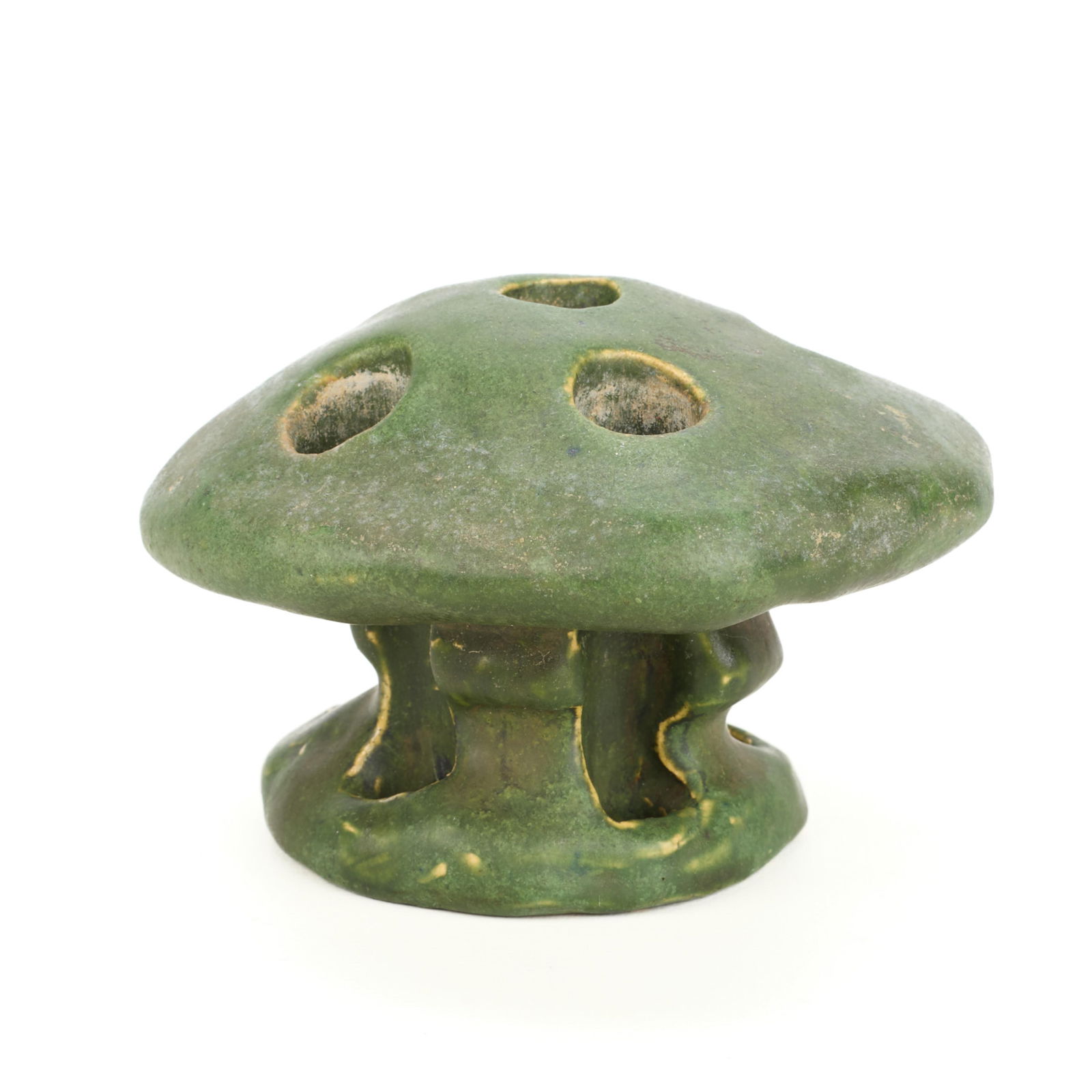 Handicraft Guild Arts & Crafts Ceramic Flower Frog: Handicraft Guild of Minneapolis, Minnesota. Arts & Crafts art pottery flower frog in the form of a mushroom. Executed in an matte green glaze. Marked along the underside.Height: 3 in x diameter: 4 in.