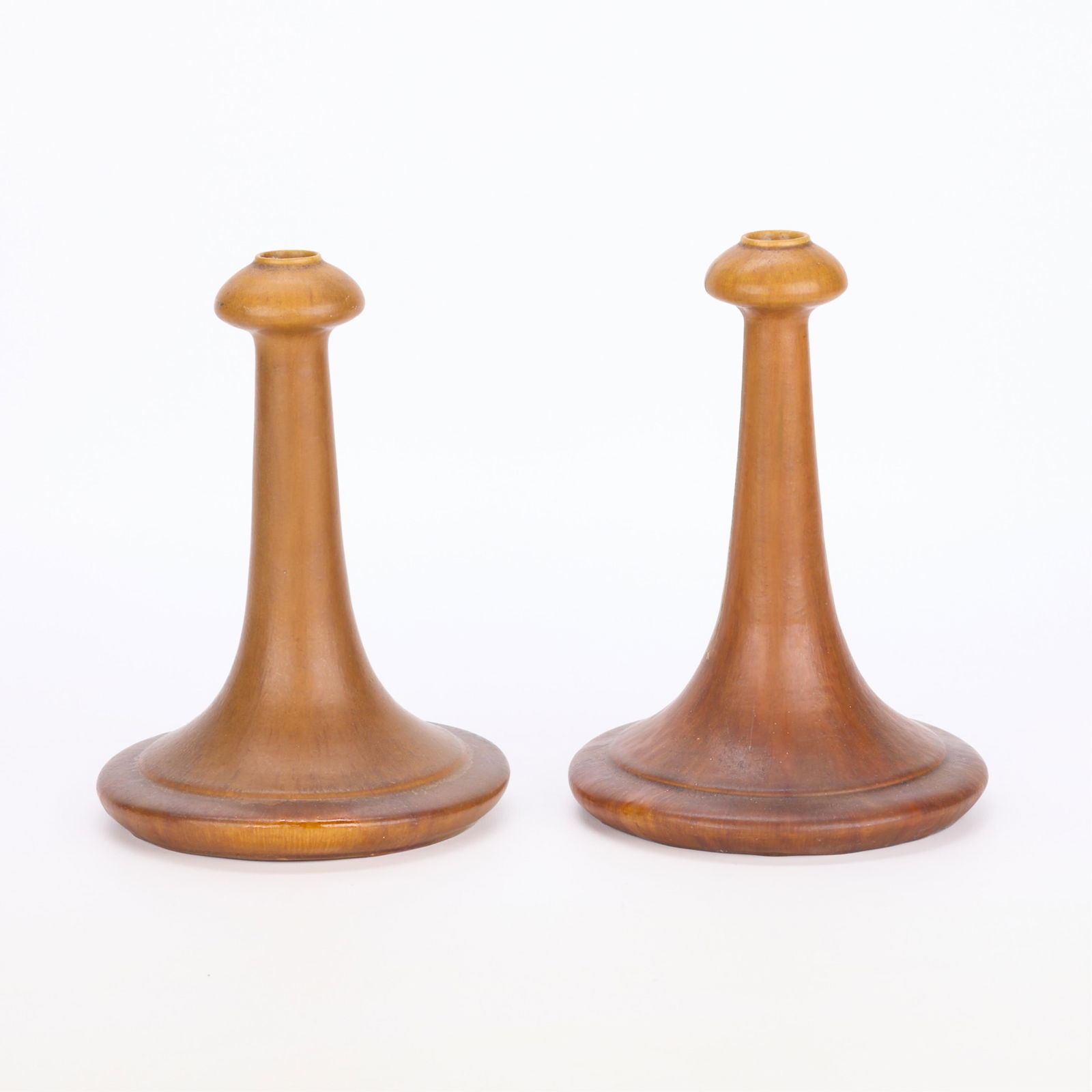 Pr Handicraft Guild Pottery Ceramic Candlesticks: Handicraft Guild of Minneapolis, Minnesota. Pair of Arts & Crafts ceramic candlesticks or candleholders, ca. 1900s-1910s. Each with a rounded base, tapered neck, and bulbous bobeche cup.Literature: St