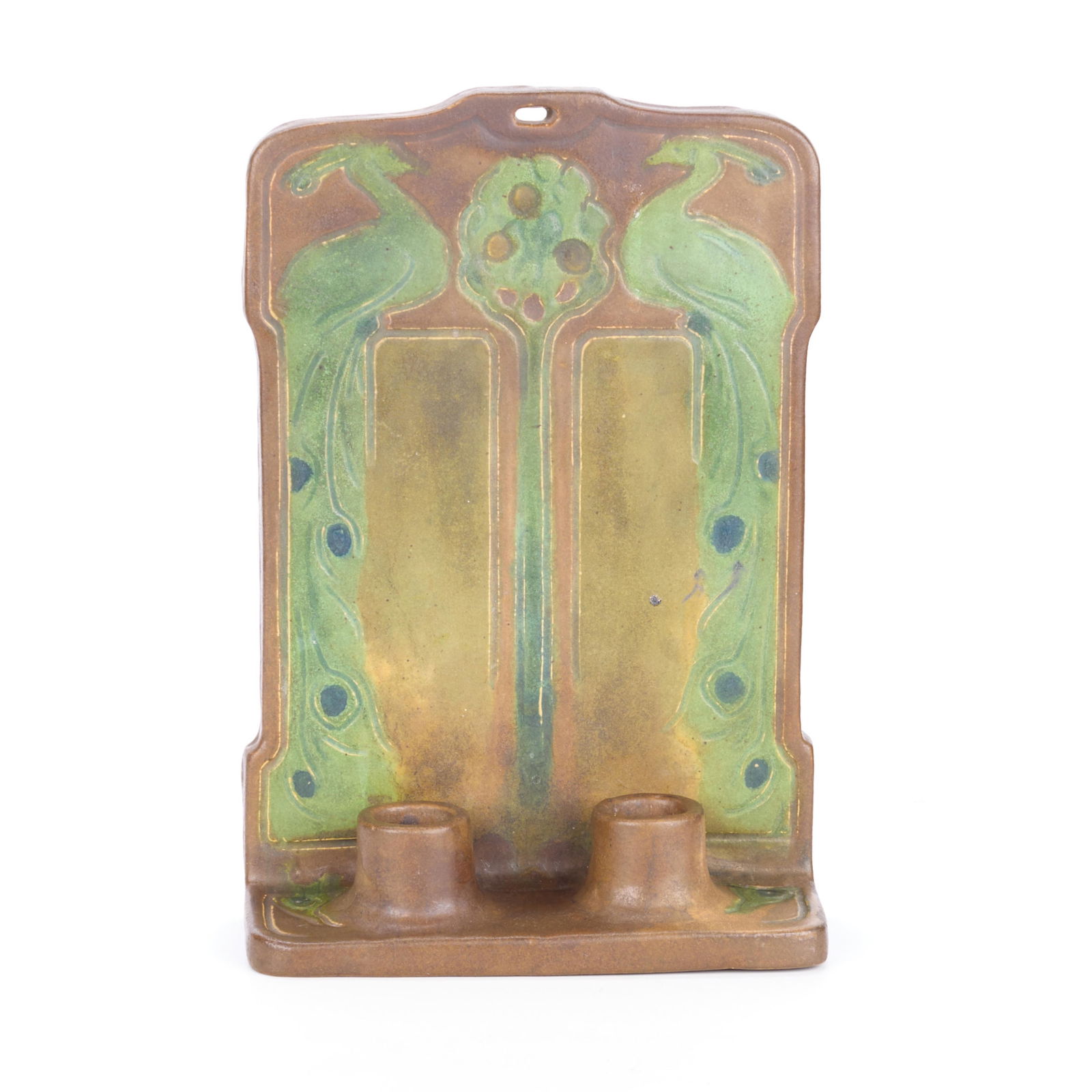 Handicraft Guild Arts & Crafts 2-Light Wall Sconce: Handicraft Guild of Minneapolis, Minnesota. Arts & Crafts art pottery ceramic double candlestick or two-light wall sconce, ca. 1900s-1910s. Depicting symmetrical peacock motifs. With a paper label and