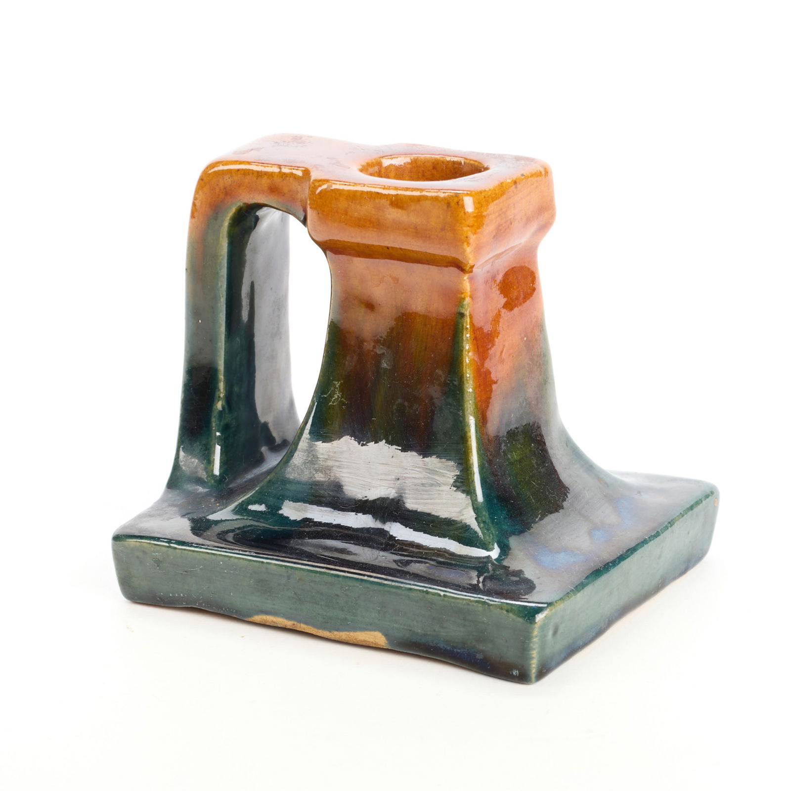 Handicraft Guild Arts & Crafts Pottery Candlestick: Handicraft Guild of Minneapolis, Minnesota. Arts & Crafts ceramic candlestick, candle holder, or chamberstick, ca. 1900s-1910s. Of geometric form, executed in a blend of orange, green, and blue glazes