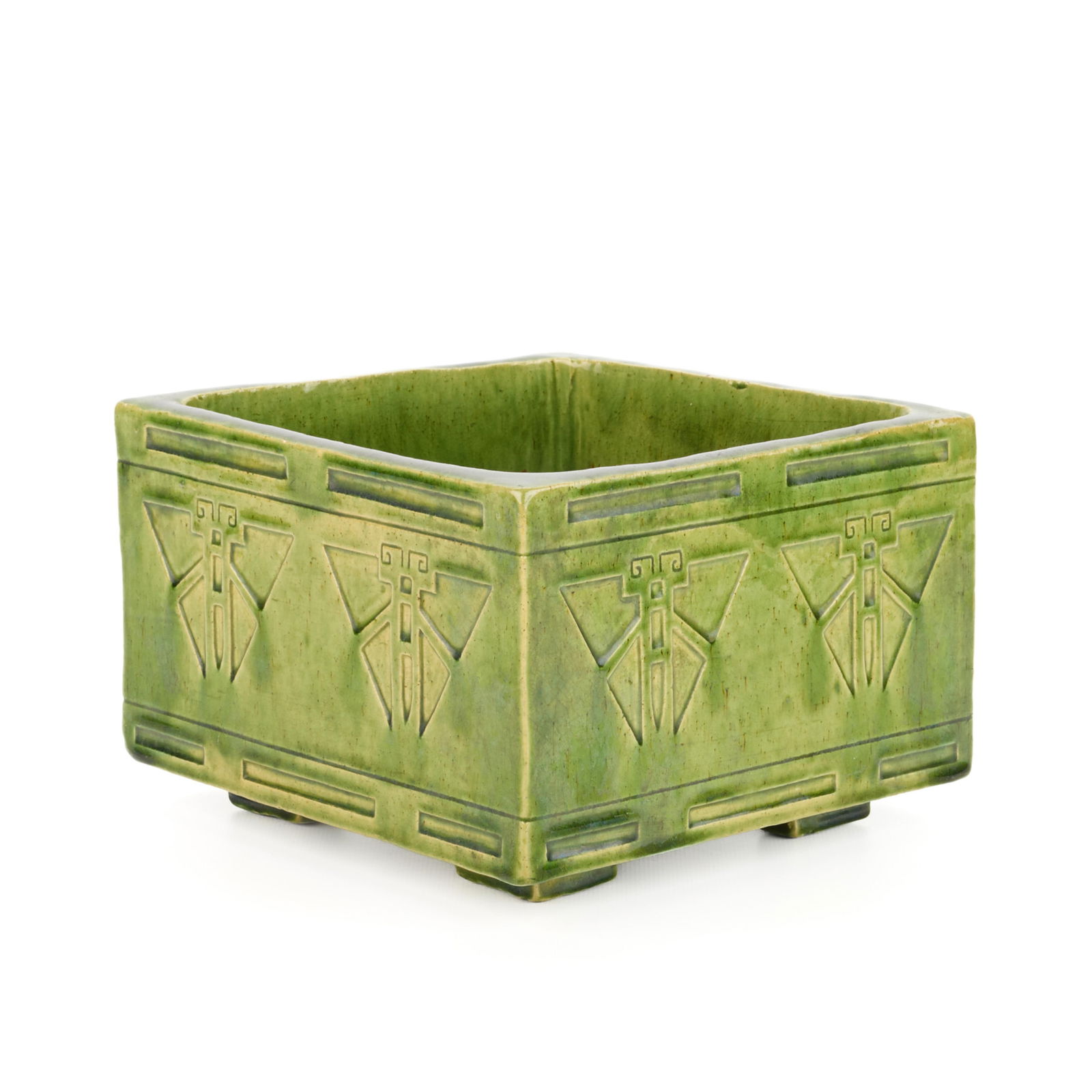 Arts & Crafts Guild Style Square Pottery Planter: Style of the Handicraft Guild of Minneapolis, Minnesota. Arts & Crafts pottery jardiniere planter or vase depicting incised moth or butterfly motifs, early 20th century. Of square form, resting on fou