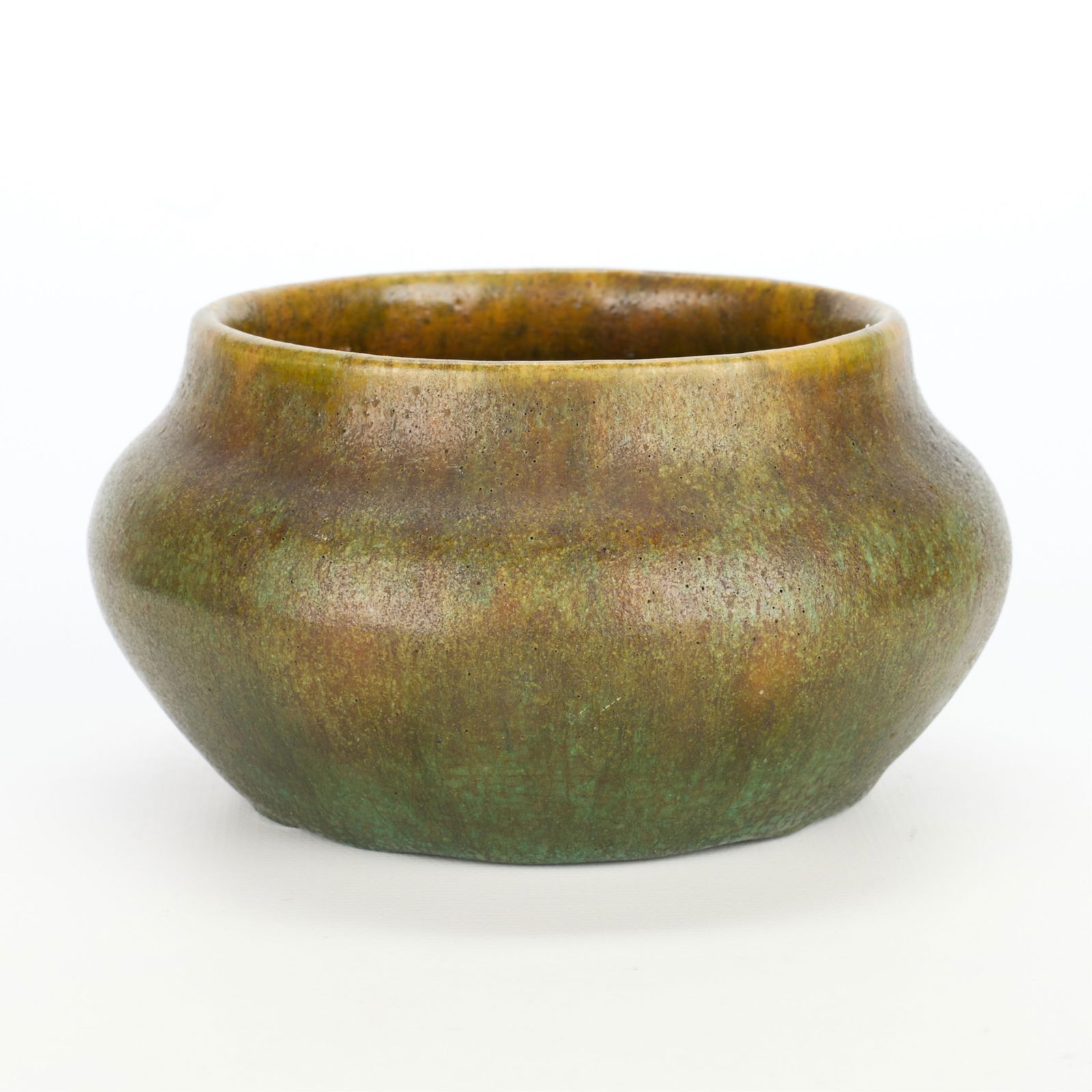 Arts & Crafts Ceramic Green Bud Vase: Arts & Crafts pottery bud vase or bowl of rounded form. Executed in a blend of earth-tone green glazes.Height: 3 in x diameter: 4 3/4 in.