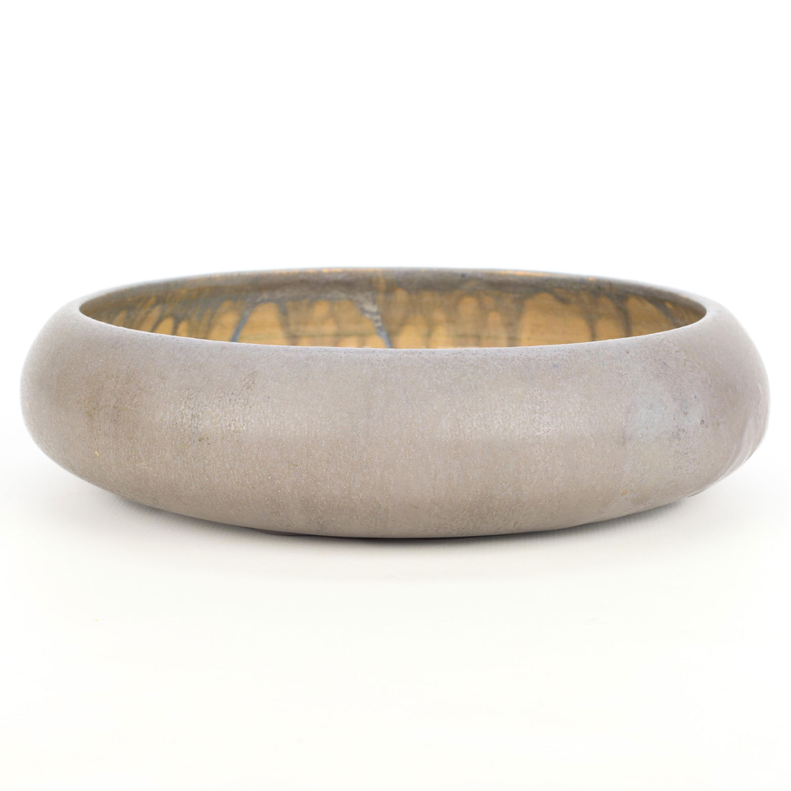 Arts & Crafts Ceramic Purple Drip Glaze Bowl: Arts & Crafts pottery low bowl of rounded form. Executed in a pale violet drip glaze.Height: 2 in x diameter: 7 1/2 in.