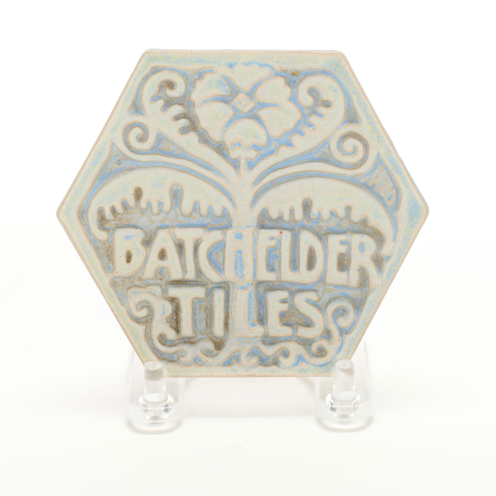 Ernest Batchelder Ceramic Advertising Tile: Ernest Batchelder (American, 1875-1957) for Batchelder Tile Company, California, United States. Arts & Crafts ceramic advertising tile depicting foliate motifs. Of hexagonal form.Batchelder played a p