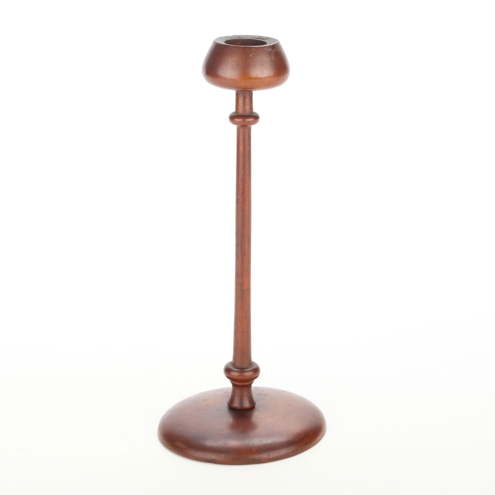Ethel Wheeler Studio Turned Wood Candlestick: Studio Arts & Crafts turned wood candlestick or candleholder. With a tall, slender turned stem, circular base, and rounded top. With a signed label affixed along the underside.Height: 10 1/2 in x diam