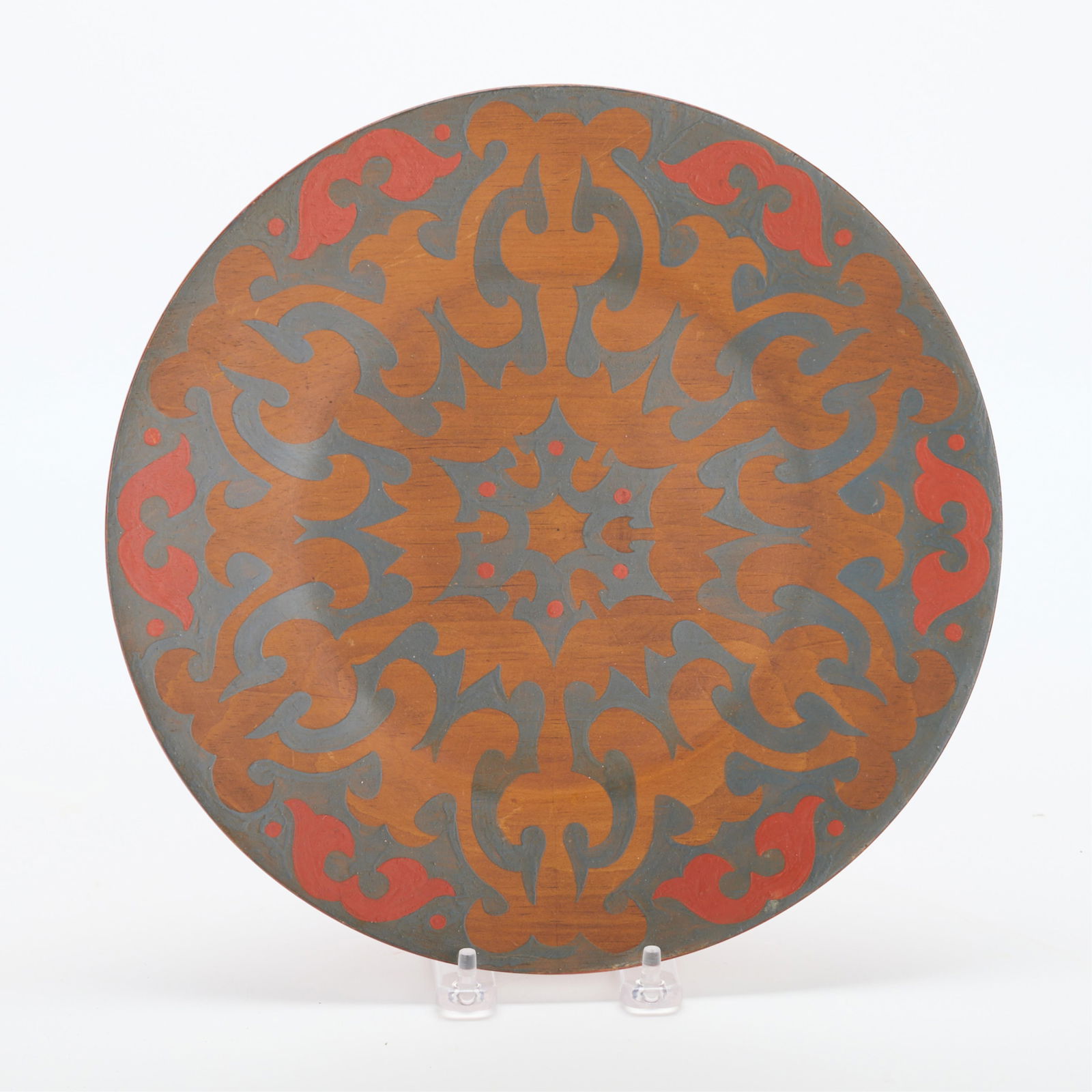 Minneapolis Handicraft Guild Floral Wooden Charger: Handicraft Guild of Minneapolis, Minnesota. Arts & Crafts wooden decorative charger plate or plaque with painted foliate motifs. Marked along the underside. Diameter: 11 in.