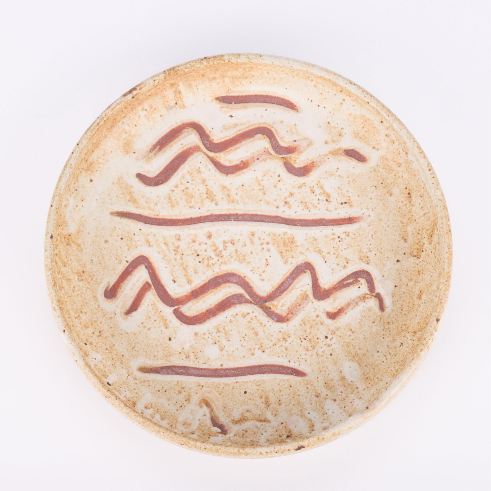 Warren Mackenzie Studio Pottery Dish - Marked: Warren MacKenzie (American, 1924-2018). Studio pottery ceramic bowl or platter with raised sides rim. Stoneware with a shino glaze and finger mark or slip-trailed designs. Stamped along the footrimWar