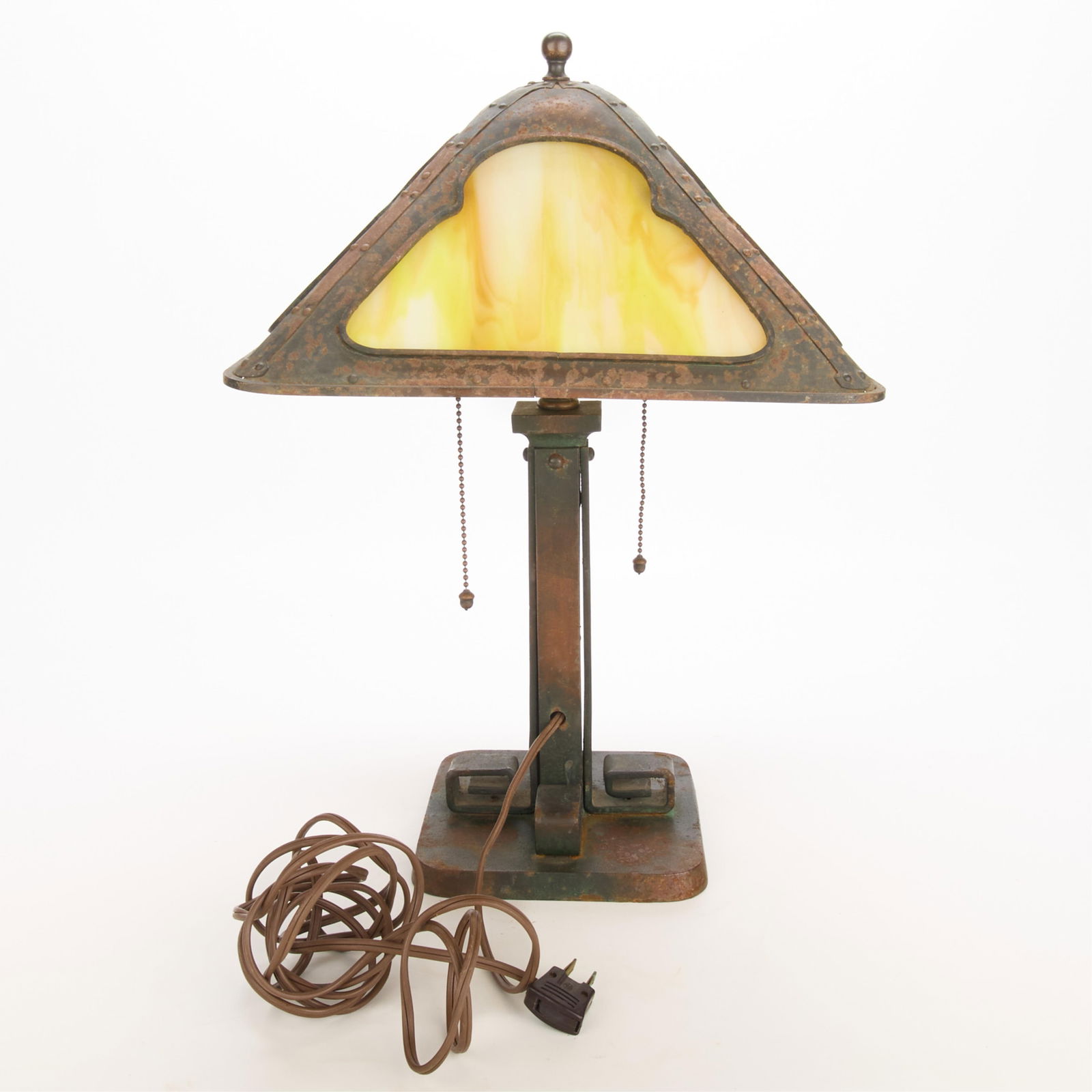 Attr. Bradley & Hubbard Arts & Crafts Glass Lamp: Attributed to Bradley & Hubbard Manufacturing Co., Connecticut, United States. Arts & Crafts or Prairie School cast iron table lamp with amber slag glass paneling, ca. 1910s-1920s.Height: 18 in x widt