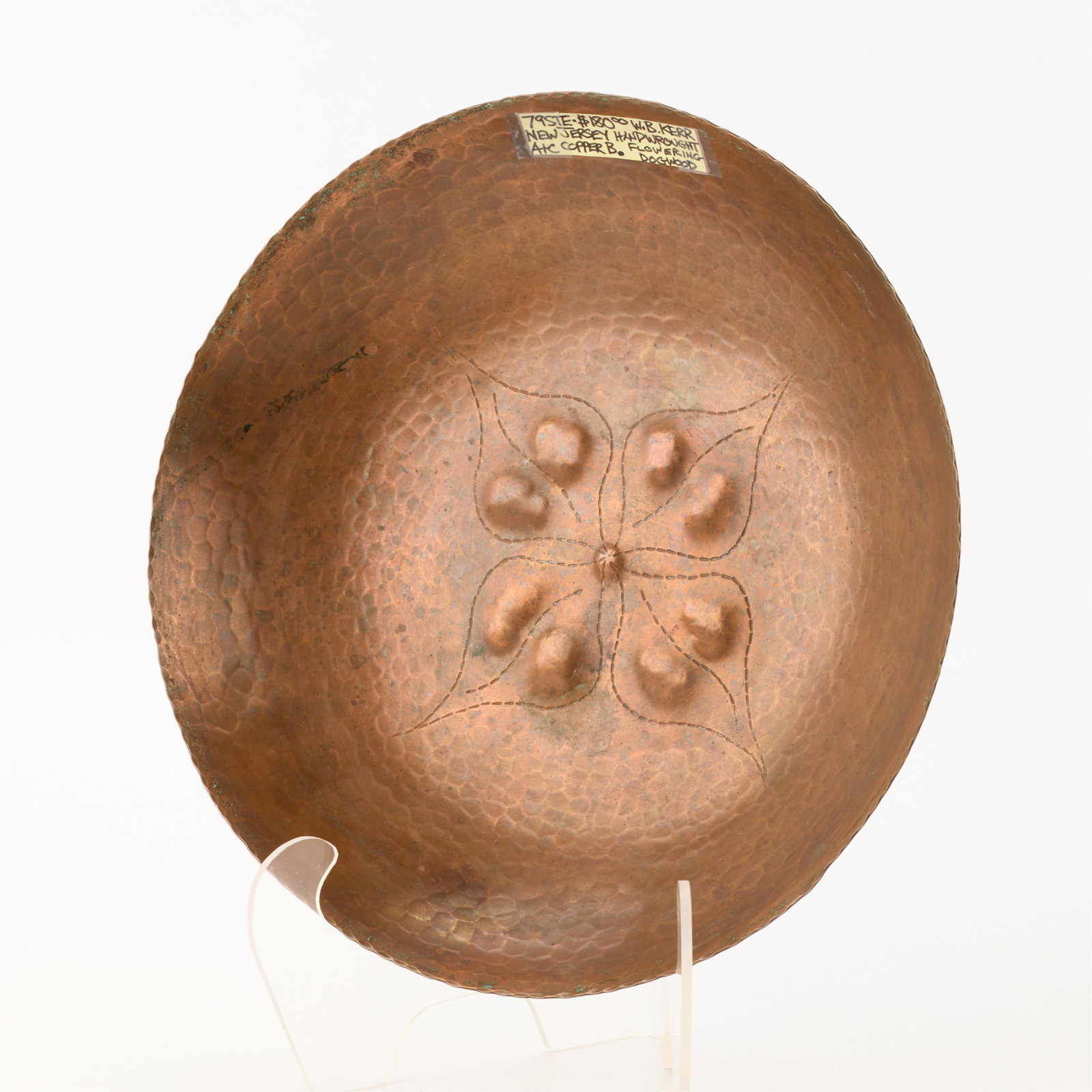 Kerr Arts & Crafts Hammered Copper Dogwood Bowl: William B. Kerr Co., New Jersey, United States. Large American Arts & Crafts hand-wrought and hammered copper bowl. Depicting a blooming dogwood flower in relief. Marked "KERR" along the underside.Hei