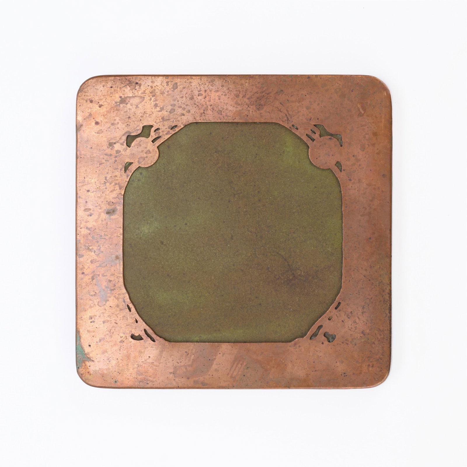 Minneapolis Handicraft Guild Copper Hot Plate: Handicraft Guild of Minneapolis, Minnesota. Arts & Crafts copper hot plate with a ceramic tile insert. Stamped along the underside.Height: 3/4 in x width: 6 1/4 in x depth: 6 1/4 in. Weight: 1 lb 15 o
