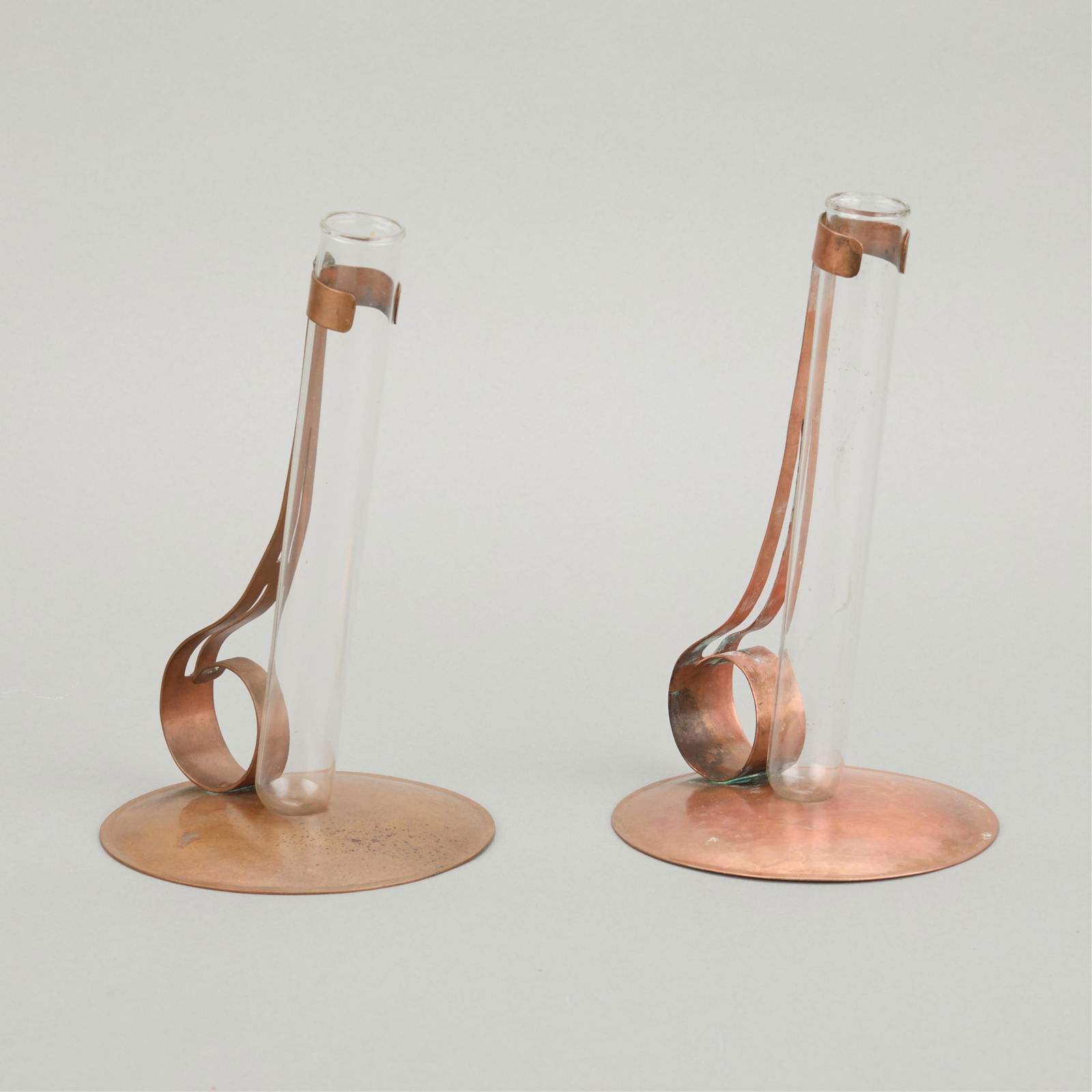 Minneapolis Handicraft Copper Propagation Vases: Handicraft Guild of Minneapolis, Minnesota. Arts & Crafts handwrought copper propagation or stem floral vases, ca. 1900s-1910s. Each with glass beaker inserts. Stamped along the underside.(Each) Heigh