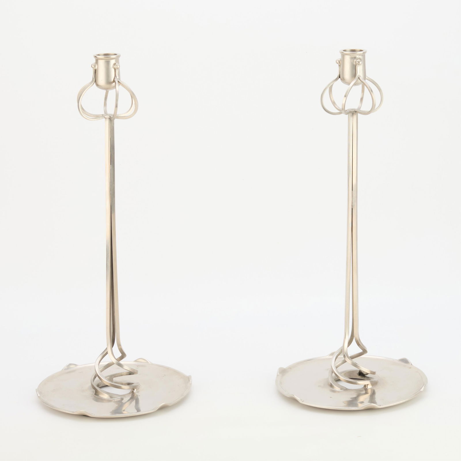 Pr German Nouveau Jugendstil Metal Candlesticks: Pair of German Art Nouveau or Jugendstil style cast and wrought metal candlesticks, early 20th century. Similar in style to a pair of candlesticks designed by architect Richard Muller (German, 1874-19
