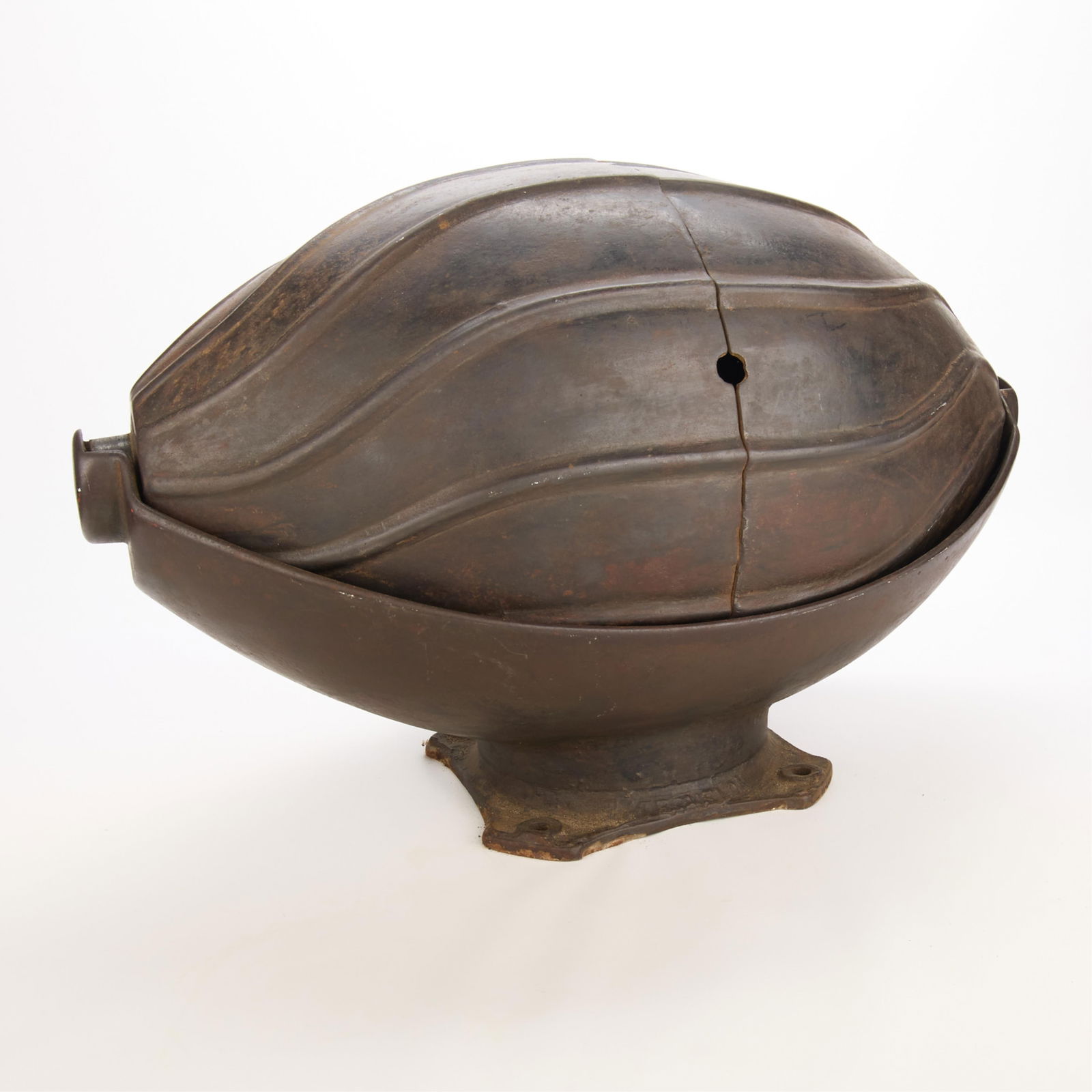 Early 20th c. Cast Iron Watermelon Hog Oiler: Vintage cast-iron "watermelon" model hog or pig oiler, early 20th century. Height: 15 1/2 in x width: 22 in x depth: 15 in.