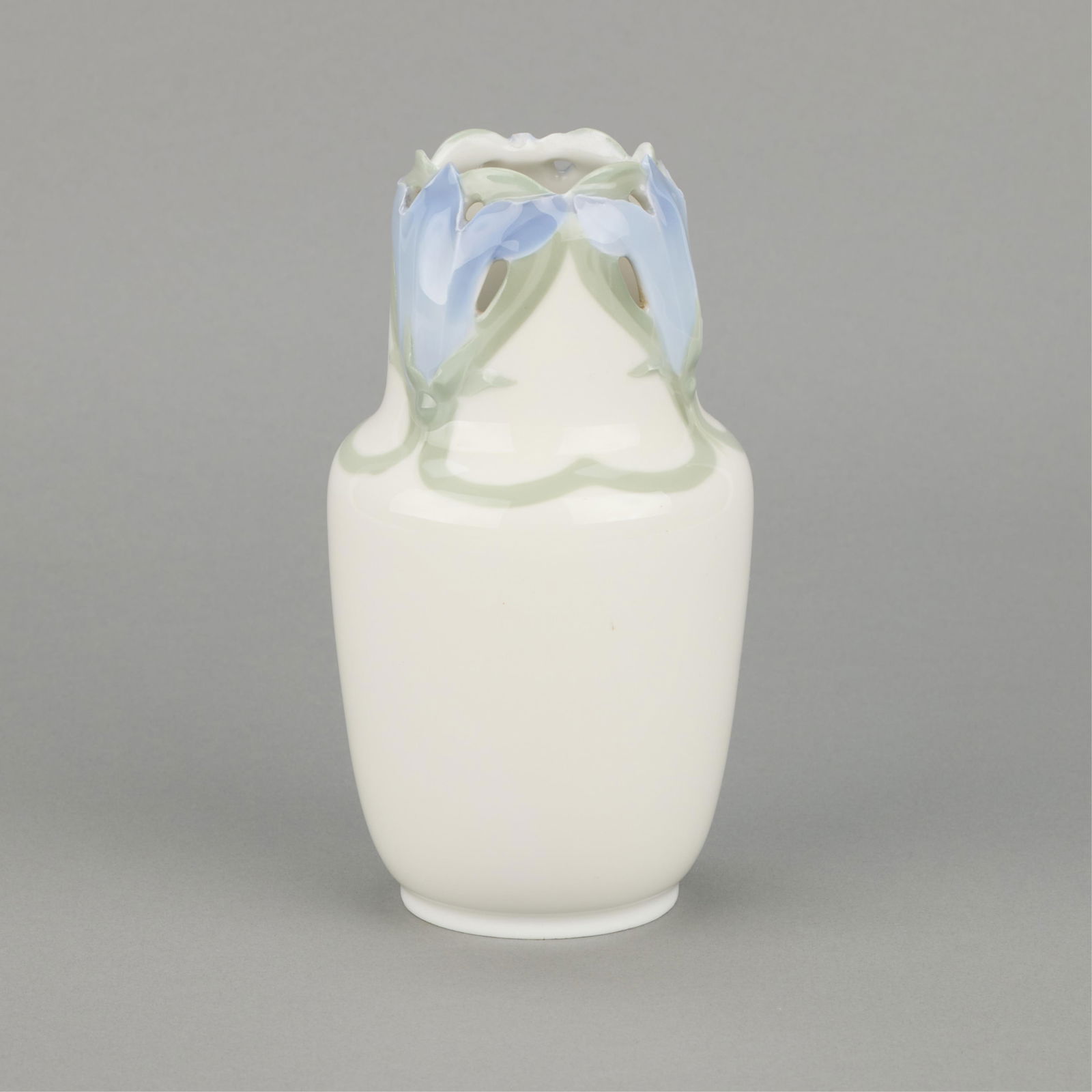 Lundstrom for Rorstrand Art Nouveau Porcelain Vase: Nils Emil Lundstrom (Swedish, 1865-1960) for Rorstrand, Sweden. Art Nouveau porcelain vase depicting reticulated blooming floral motifs along the neck against a cream ground, early 20th century. With