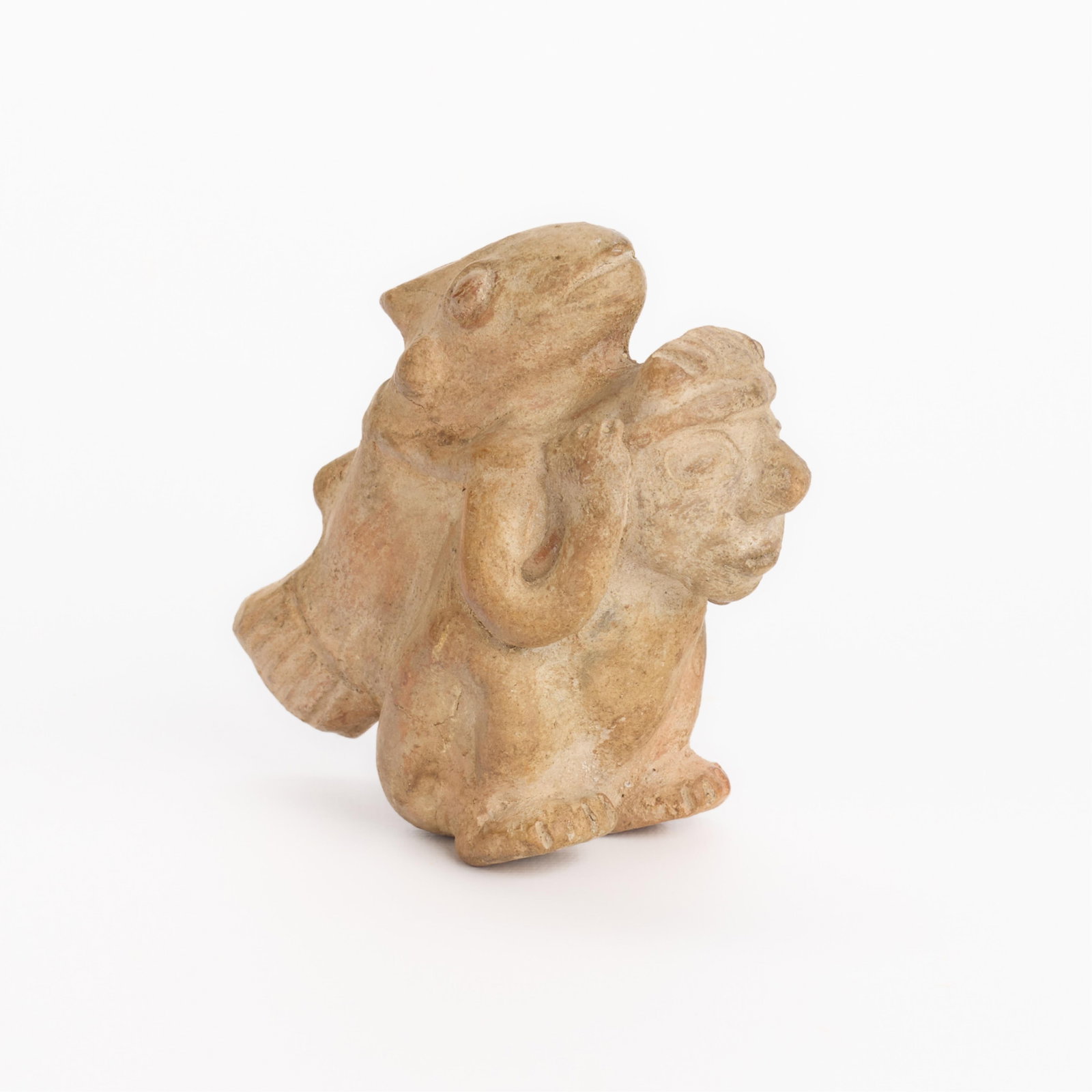 Pre-Columbian Pottery Fisherman Figure: Pre-Columbian terracotta pottery effigy figure depicting a male figure with monumental fish or shark. Provenance: Private Minnesota Collection. Height: 4 in x width: 4 in x depth: 2 1/2 in