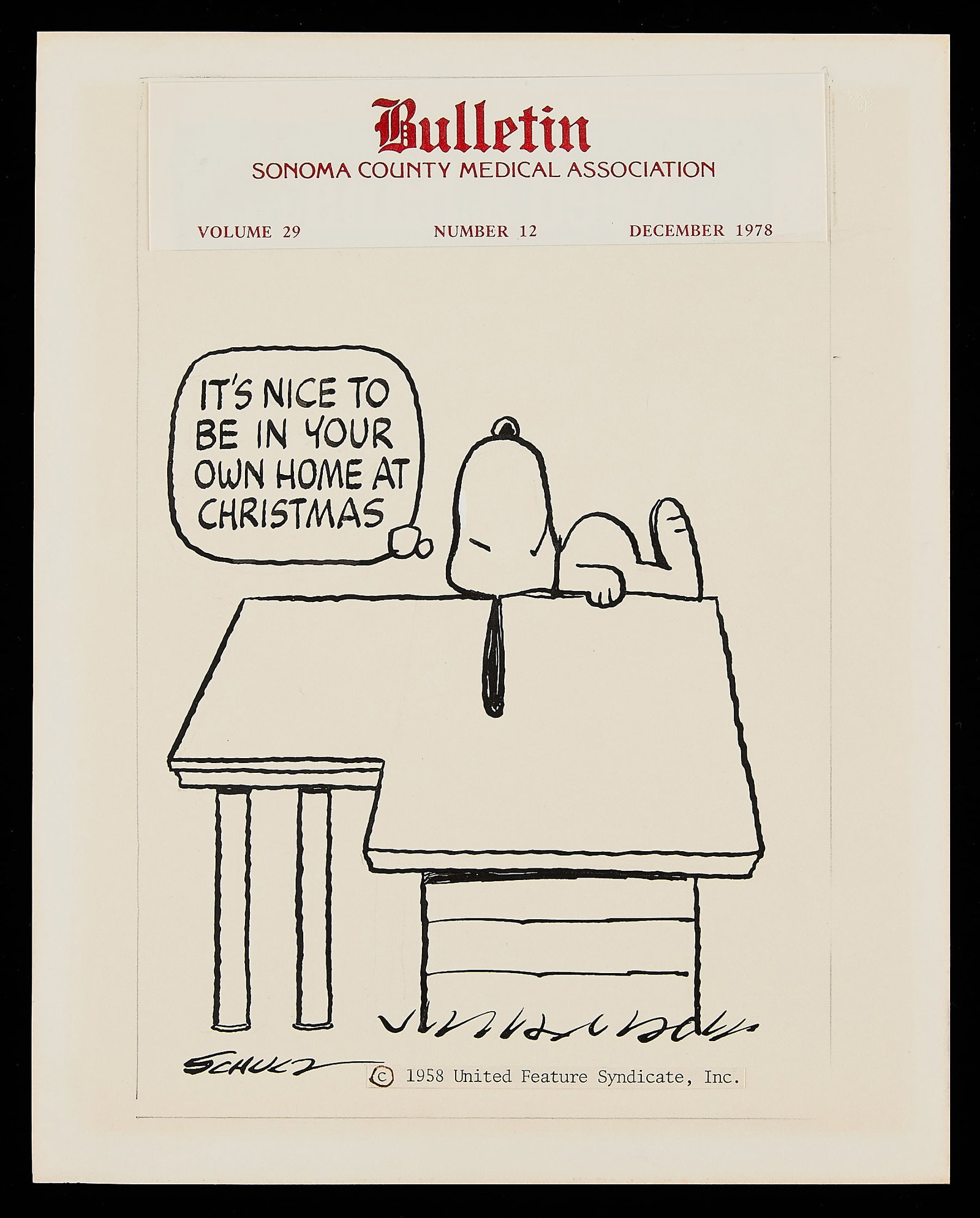 C. Schulz "Home at Christmas" Original Drawing: Charles Schulz (American, 1922-2000). Original ink on paper drawing captioned "It's nice to be in your own home at Christmas." Depicting Snoopy happily laying atop his doghouse. Signed along the lower