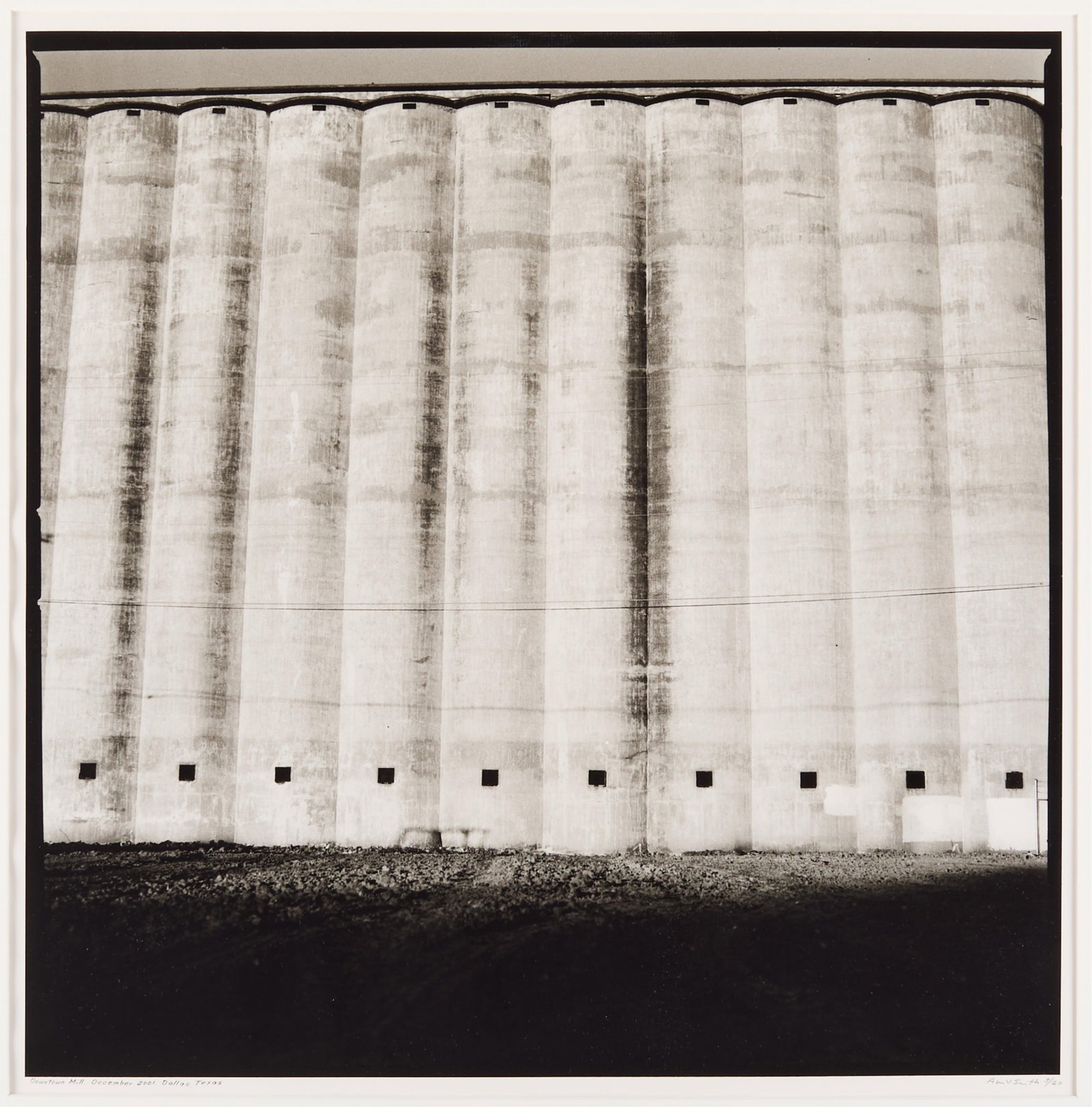 Allison V. Smith "Downtown Mill" Photograph 2003: Allison V. Smith (American, 20th/21st century). Warm tone gelatin silver fiber print photograph on paper titled "Downtown Mill December 2001, Dallas, Texas," 2003. Depicting monumental grain silos or 