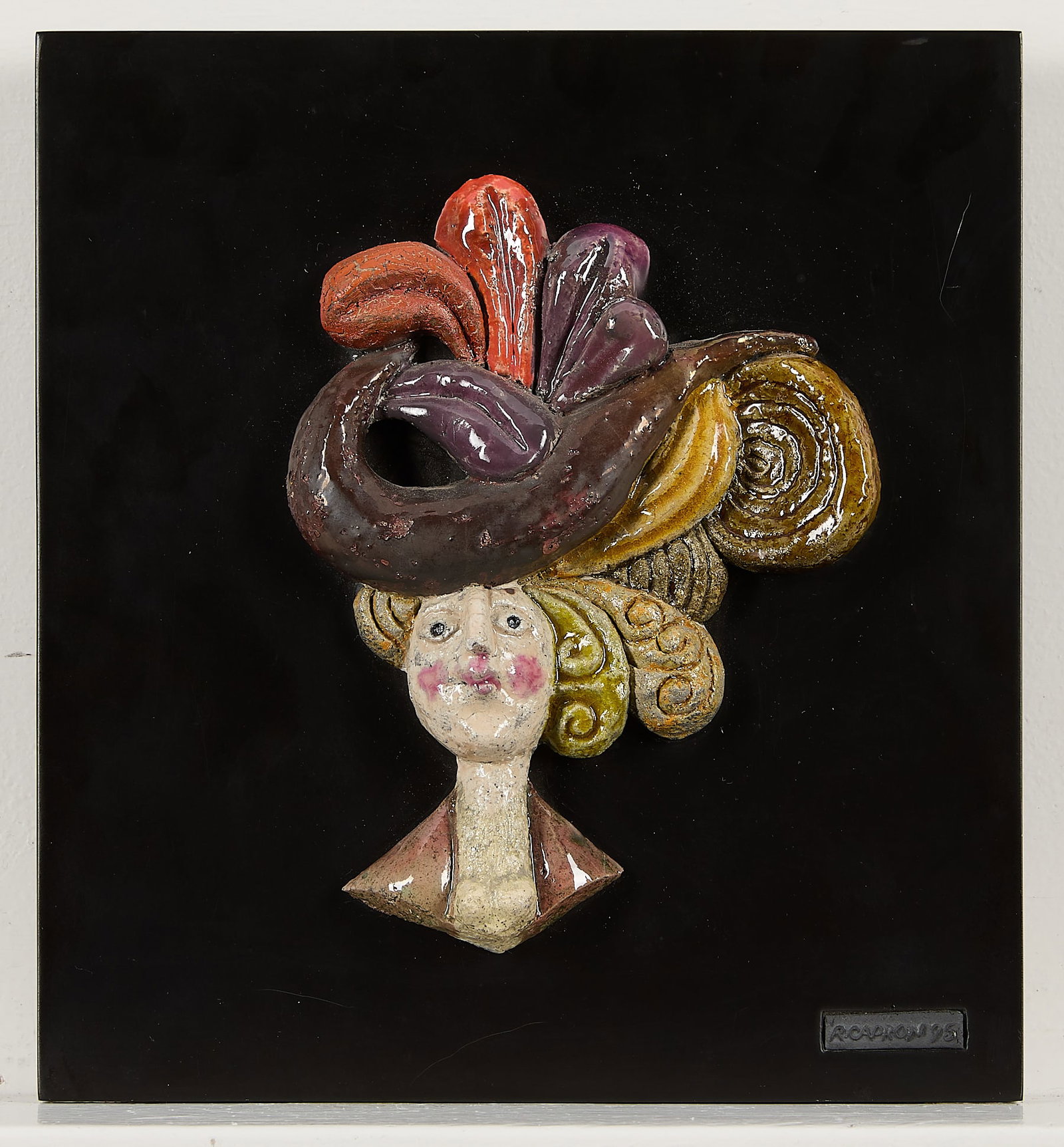 Roger Capron Ceramic Portrait 1995: Roger Capron (French, 1922-2006). Ceramic wall portrait depicting a stylized female bust wearing a colorful, elaborate hat and bold blush. Embossed signature and dated 1995 along a plaque along the lo