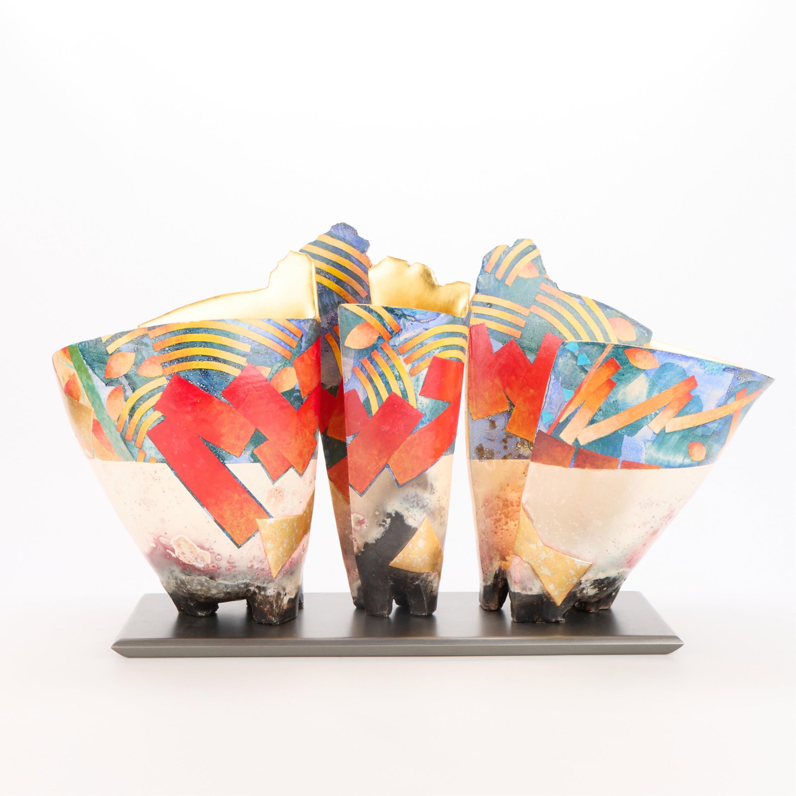 Bennett Bean "Triple on Base #481" Sculpture: Bennett Bean (American, b. 1941). Post-modern studio pottery ceramic sculpture titled "Triple on Base #481," composed of three angular vessels, 20th-21st century. Each vessel resting on three square t