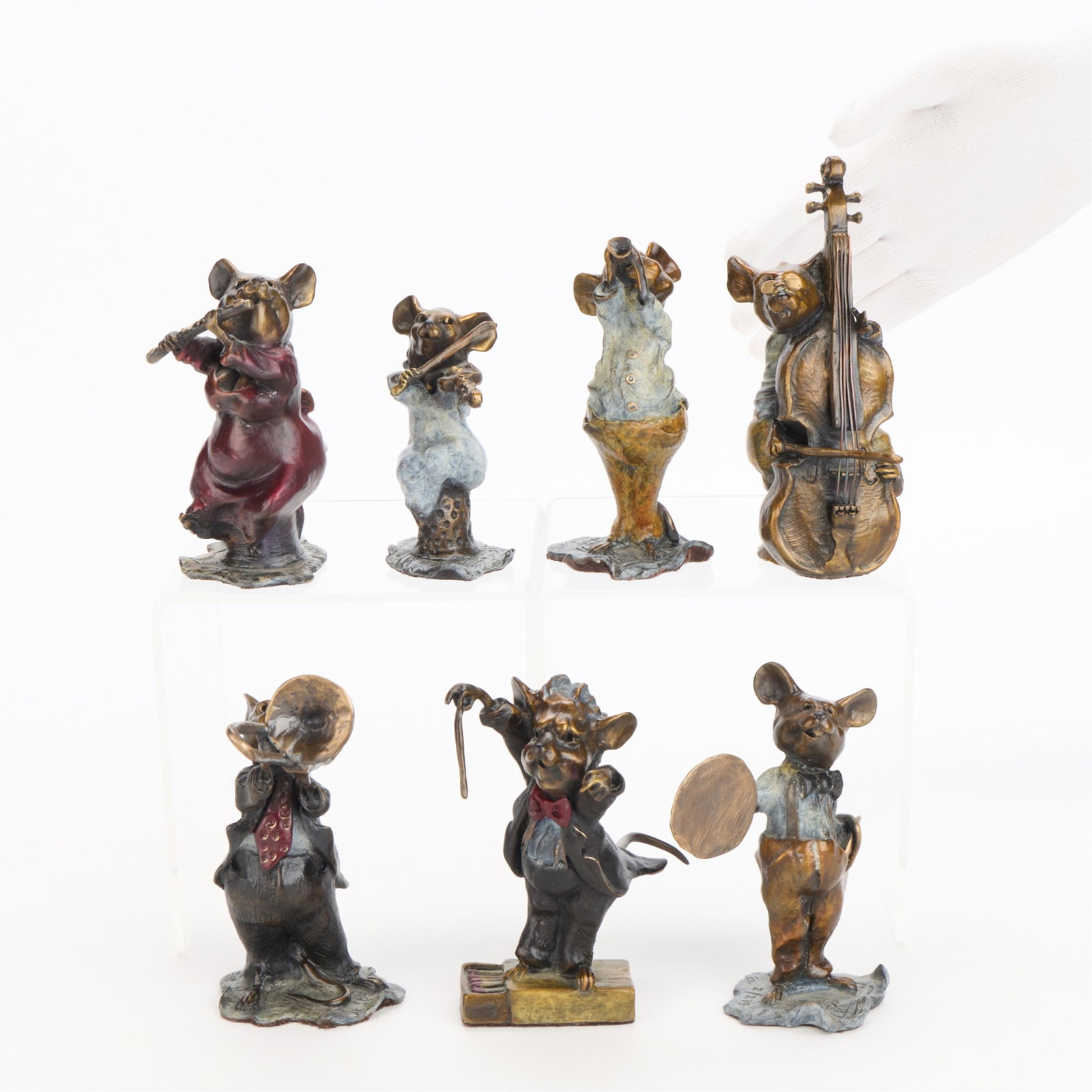 7 Walt Horton "Micetro Orchestra" Bronze Figures: Walt Horton (American, 1953-2010). Group of seven bronze figures depicting anthropomorphic mice playing instruments, 2010. Including: One figure depicting a mouse playing a trombone. Incised signature