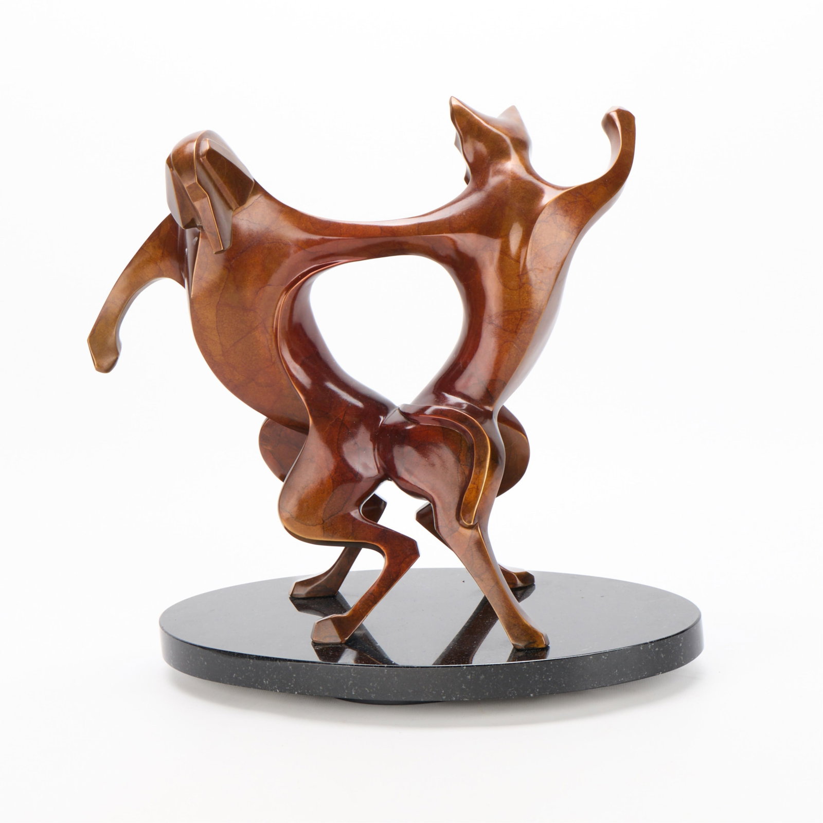 L. Peterson Gregory "Behind Closed Doors" Bronze: Laurel Peterson Gregory (American, 20th/21st century). Bronze sculpture titled "Behind Closed Doors" depicting an elegantly intertwined cat and dog figure in dance. Surmounted atop a swiveling granite
