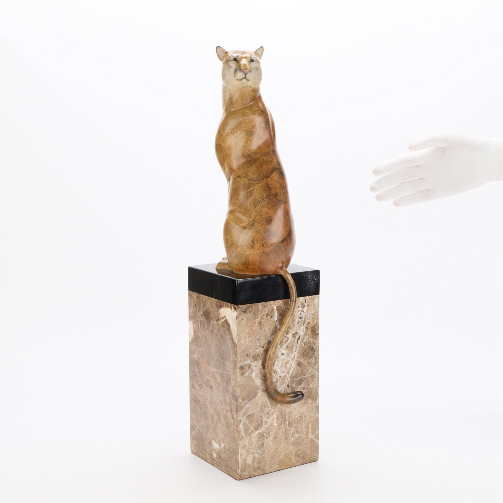 Joshua Tobey "Lion's View" Bronze Sculpture 2014: Joshua Tobey (American, 20th/21st century). Bronze sculpture titled "Lion's View, 2014. Depicting a seated lion with mottled yellow and tan patina. Surmounted atop a rectangular base. Incised signatur