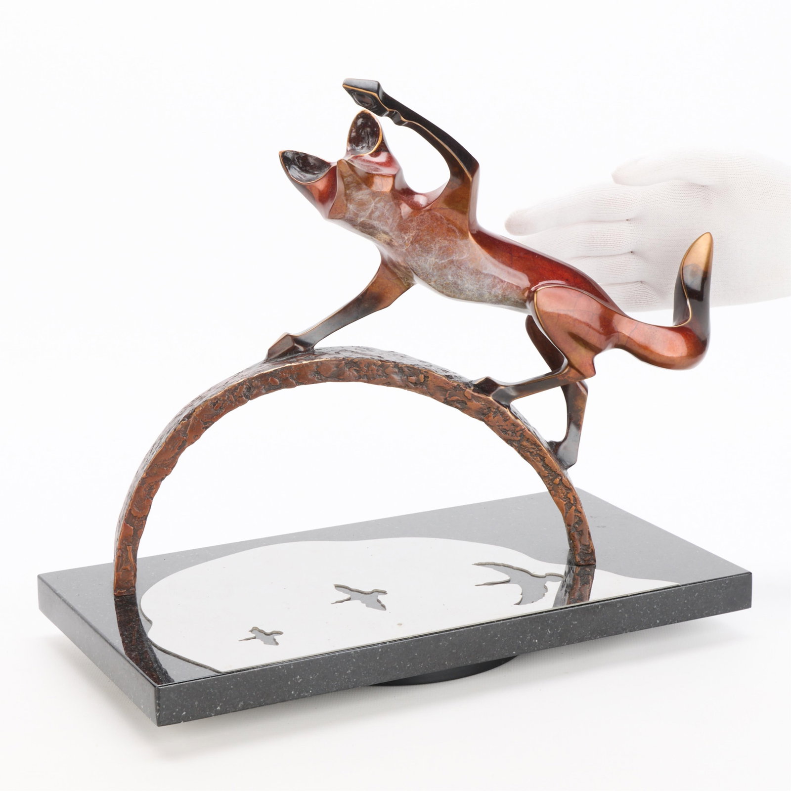 Laurel Gregory "Pause for Distraction" Bronze: Laurel Peterson Gregory (American, 20th/21st century). Cast bronze sculpture titled "Pause for Distraction" depicting a lively fox with red patina atop an arch, 21st century. Editioned 3/77 along the 