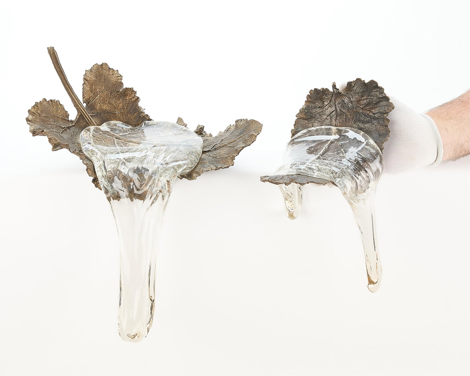 2 Daisuke Shintani Bronze Leaf Sculptures: Daisuke Shintani (Japanese, 20th/21st century). Group of two bronze sculptures in the forms of leaves with molten glass, emulating pooled water, 1998. Both with incised signature and date along the ve