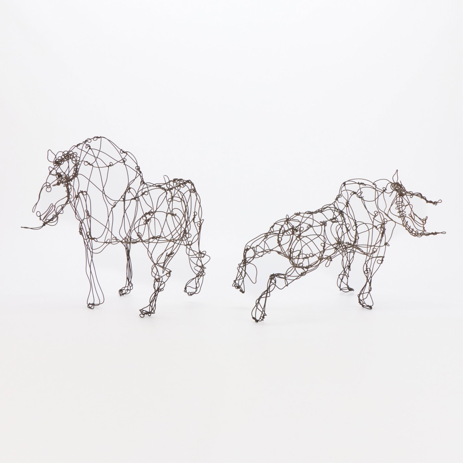 2 Thai Varick Steel Wire Sculptures - Horse & Bull: Louis "Thai" Gladding Varick, Jr. (American, b. 1941-2001). Group of two abstract steel wirework animal sculptures, 20th century. Including one form depicting a bull with protruding horns and one form