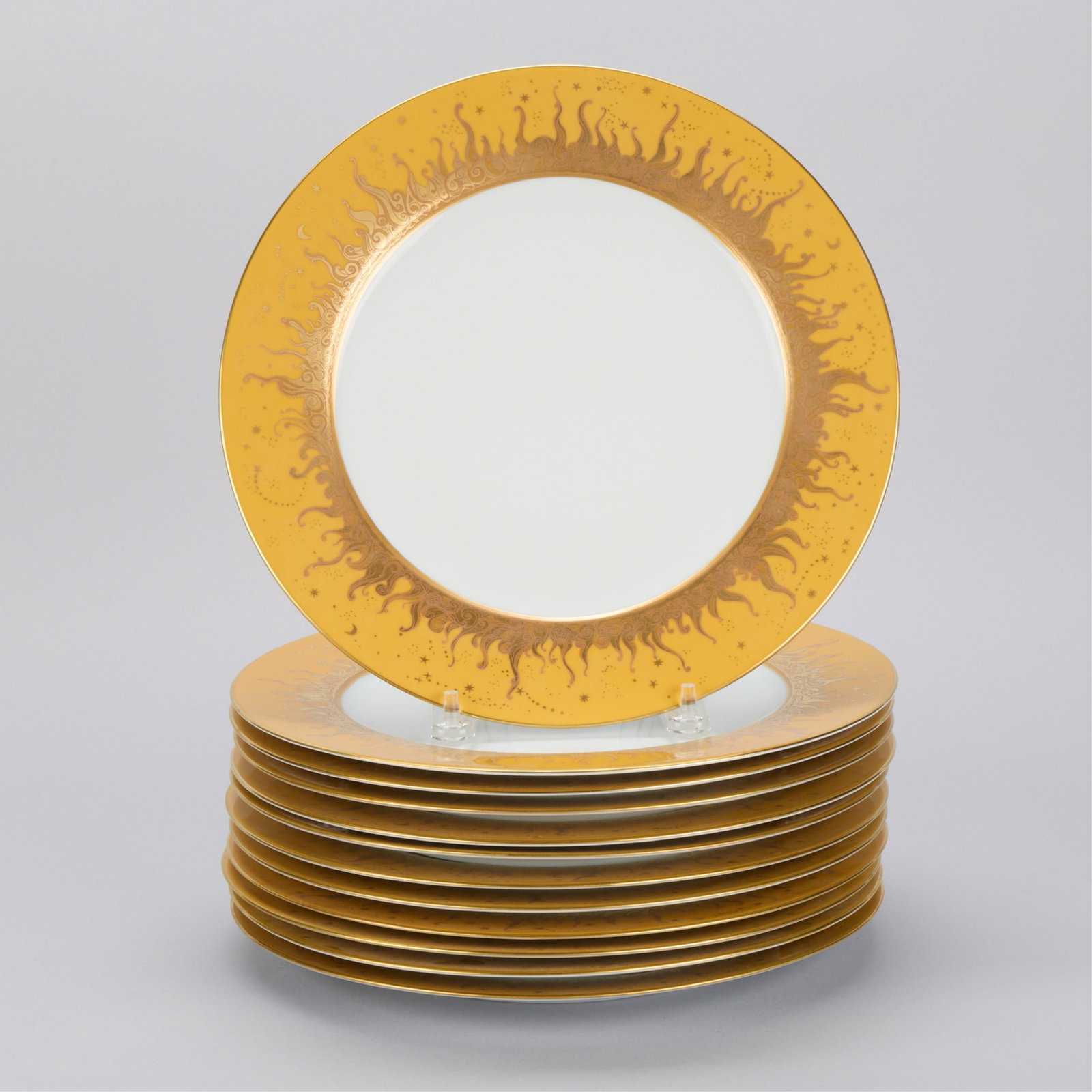 Set 12 Haviland Limoges "Ritz Club" Dinner Plates: Haviland & Co., Limoges, France. Set of 12 "Ritz Club" porcelain dinner plates. Decorated with gilt sunburst motifs. Stamped along the undersides. (Each) Diameter: 12 in.