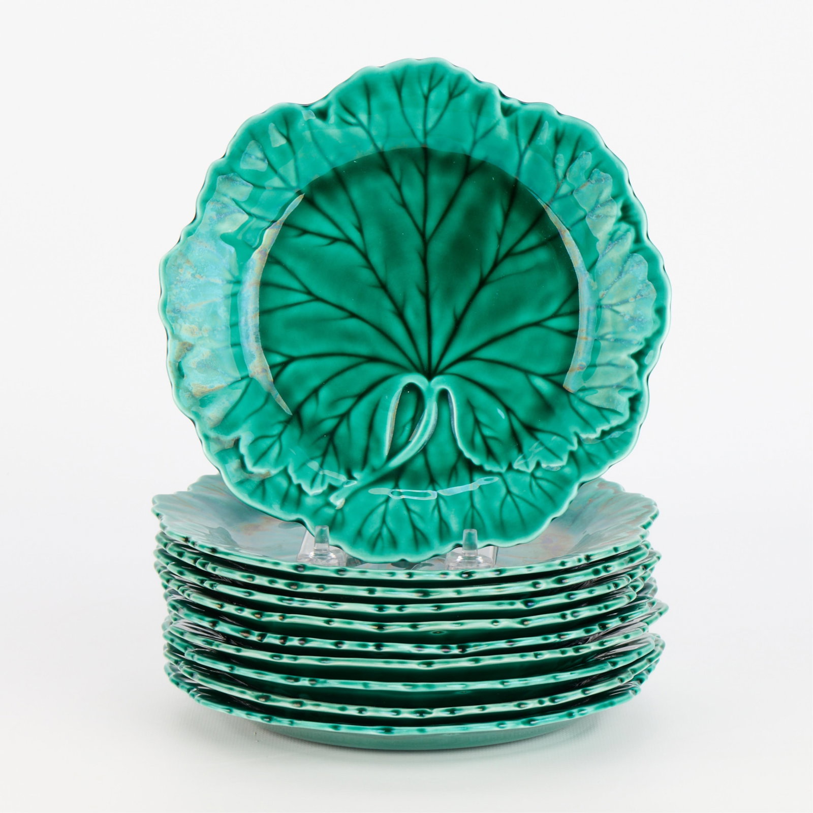 Set 10 Wedgwood Majolica Pottery Cabbage Plates: Wedgwood Pottery, England. Set of ten ceramic maiolica "cabbage leaf" plates, ca. 1940s-1960s. Each of vegetal form with verdant green glaze. Each plate impressed "Wedgwood," "A 7," "GG," and numbered