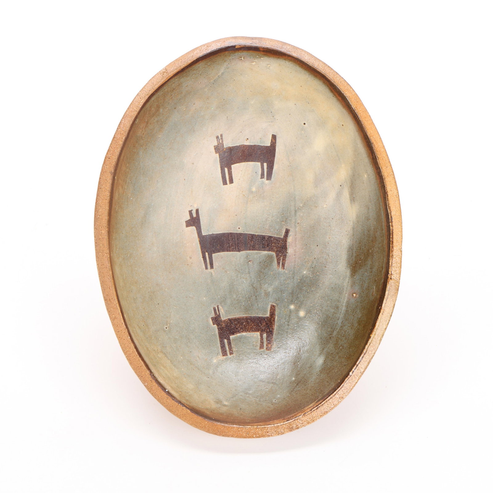 Early Randy Johnson Studio Ceramic Petroglyph Bowl: Randy Johnson (American, b. 1950). Early studio pottery wood-fired bowl of ovoid form. Depicting three zoomorphic figures, resembling petroglyphs, and a ribbed exterior. Impressed stamp mark along the